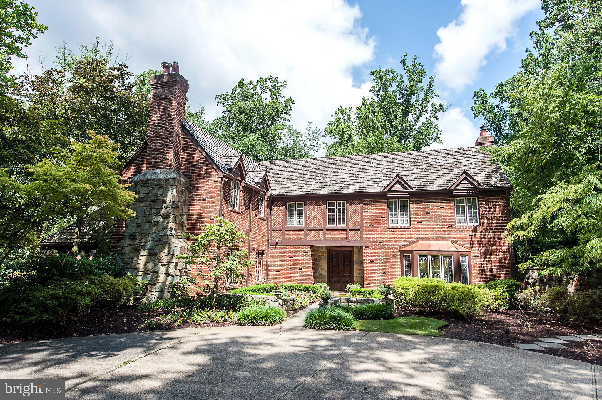 Beautifully-built, all brick custom English gem in close-in Potomac. Unbelievable value for this 6 BR home with pool that includes a long list of amenities, upgrades and special features. Rich hardwoods, custom built ins, paneling and designer stone throughout. Main level features office with leaded glass windows, embassy-sized dining room with fireplace, glass conservatory/great room with Jerusalem marble floors, theater room, 2000 bottle wine cellar, marble gallery with skylights and screened porch. Upstairs an owner's suite with huge "his" and "her" dressing suites and baths creates the ultimate escape. Five secondary bedrooms, each with en suite bath, a laundry room and exercise room complete the upper level. The lushly landscaped lot is close to an acre and a half and features matures trees, a circular drive and side load two car garage. Easy access to several major commuting routes, 495, a multitude of public and independent school options and the convenience of Potomac Village. This is a home is built for both grand indoor/outdoor entertaining, as well as comfortable daily living.