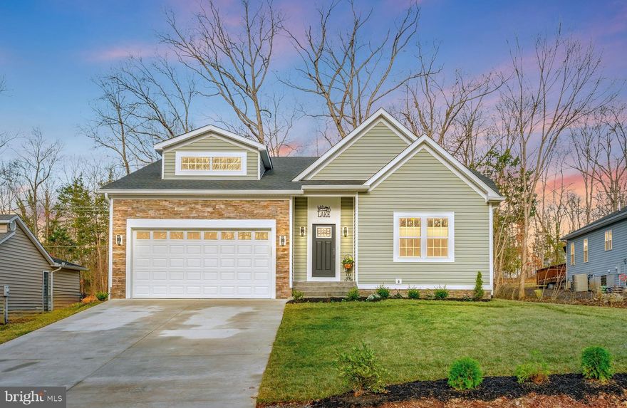 Welcome to 1310 Lakeview Pkwy! Discover the perfect blend of modern design, thoughtful upgrades, and comfortable living in this almost-new construction rambler in Lake of the Woods. With a stylish open floor plan, high-end finishes, and a beautifully landscaped lot, this three bedroom, two bathroom home is a must-see! As you step inside, you’ll be greeted by a grand foyer featuring a shiplap accent wall, setting the tone for the home’s inviting and stylish design. Off the foyer, a versatile family room provides the perfect space for a cozy sitting area, a private office, or even a potential fourth bedroom. The heart of the home is the open concept living area, where the custom kitchen flows seamlessly into the dining area, which then opens into the spacious living room. Designed for both functionality and style, the kitchen features a stunning backsplash, upgraded appliances, ample cabinetry, and sleek granite countertops, making it perfect for cooking and entertaining. The dining area offers plenty of space for gatherings and naturally transitions into the bright and airy living room, creating a perfect space for relaxation and socializing. The private primary suite is a true retreat, featuring a tray ceiling, two large walk-in closets, and an en-suite bathroom that features a gorgeous walk in shower and custom vanities, offering a peaceful escape at the end of the day. The second and third bedrooms are spacious and inviting, with one featuring a walk-in closet for added storage. Both are conveniently situated near a spa-like guest bathroom, created to provide a serene and luxurious retreat. A standout feature of this home is the massive laundry room, complete with custom cabinetry and countertops, providing both extra workspace and organization. Step outside to enjoy the beautifully landscaped lot that backs to trees, offering privacy and tranquility. The custom stone patio is the perfect outdoor retreat, whether you're enjoying morning coffee, hosting a barbecue, or simply relaxing in your own backyard oasis. Additional highlights of this home include custom blinds throughout, luxury vinyl plank flooring, and a thoughtfully designed layout that maximizes both space and style. Don’t miss your chance to own this stunning, move-in-ready home—schedule your private tour today! Lake of the Woods offers a picturesque lakeside lifestyle with an array of amenities to enjoy. At its heart lies a stunning 550 acre lake, perfect for fishing, water sports, or simply unwinding by the shore. Golf enthusiasts can tee off at the PGA course, while equestrians take advantage of scenic riding trails and a dedicated riding ring. The clubhouse provides the ideal setting to dine on the deck, savoring breathtaking sunsets as boats drift by. Beyond its amenities, this welcoming community thrives on connection, fostering friendships through engaging events and diverse clubs. With gated entrances and security patrols, residents enjoy both tranquility and peace of mind. More than just a place to live, Lake of the Woods is a vibrant retreat where nature and camaraderie come together, creating unforgettable experiences at every turn. Conveniently located in the heart of Locust Grove, this home offers easy access to shopping, dining, wineries, and historical landmarks for those who love history. Plus, with nearby commuter routes, traveling to surrounding areas is effortless. Discover the charm of this exceptional lake community. Call me today to schedule a tour and envision making it your home!