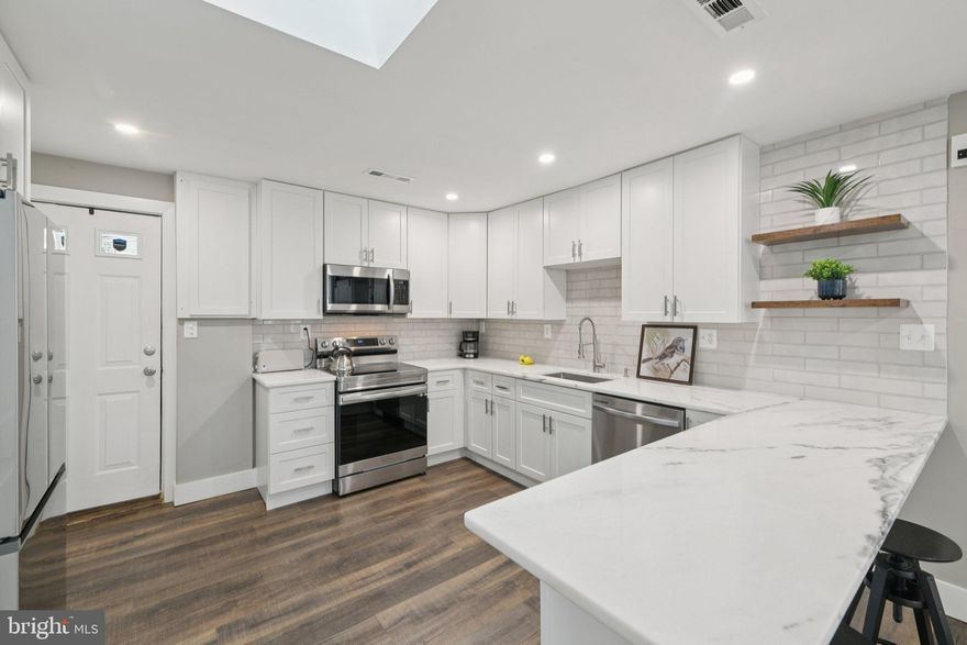 This "home sweet home" is now priced to move...WOW....Completely renovated and ready to impress! The stylish kitchen is a chef’s dream, featuring smart appliances, quartz countertops, custom cabinetry, a chic backsplash, and a spacious pantry. Luxury vinyl plank flooring flows throughout the home, enhanced by recessed lighting and an electric fireplace, creating a cozy, tech-savvy atmosphere. A centrally located skylight fills the space with streams of natural light.
The primary bedroom offers a peaceful retreat with ample closet space. The spa-inspired bathroom features a waterfall shower designed for ultimate relaxation.
The fully fenced backyard backs to a quiet, unbuildable wooded lot, offering privacy and tranquility. Enjoy outdoor living on the porcelain-tile front patio or the concrete rear patio—both perfect for relaxing or entertaining. Two sheds provide additional storage, while updated landscaping and flower beds add charm and curb appeal. An oversized driveway accommodates multiple vehicles.
Conveniently located just steps from the elementary school and minutes from Mount Vernon High School, with easy access to Richmond Highway, Route 1, and Fort Belvoir. Shops, grocery stores, and dining are nearby, making everyday errands a breeze.
This move-in-ready home combines modern updates with timeless features, offering privacy and convenience in one perfect package. Don’t miss the opportunity to call this gem your new home!