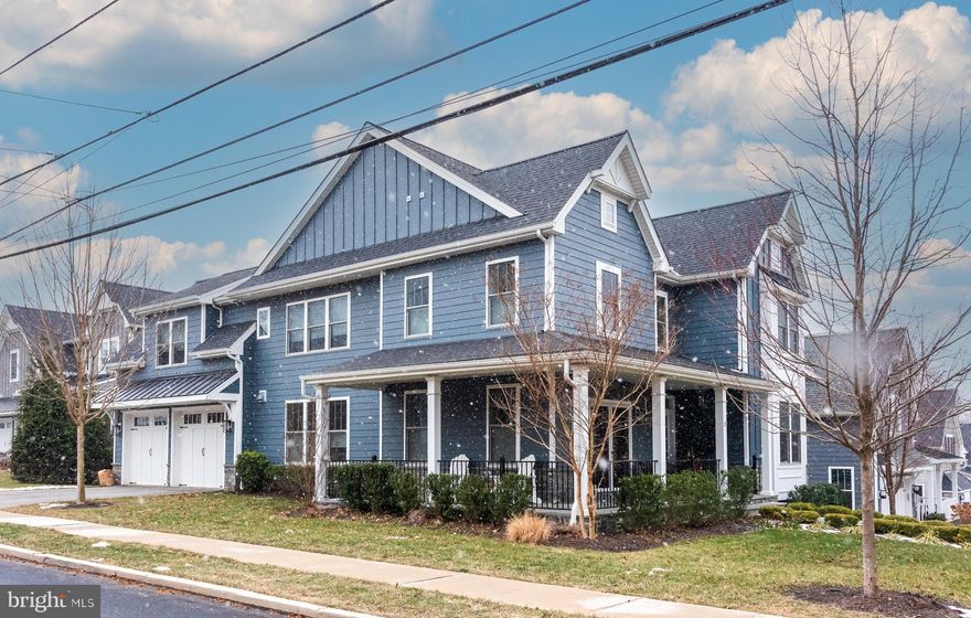 Just under six years young, this Craftsman-style home in Media Walk at Eighth is the first resale within the community. Custom-built for its owners, no detail was spared. The covered wrap-around front porch with slate flooring provides a fabulous spot to enjoy your morning coffee, read a book, or watch the Media 5-Milers run by, with plenty of room for gatherings.

Upon entry, the wide foyer leads to a study on your right and a formal dining room on your left, both featuring crown molding and wainscoting. The dining room also boasts French doors to the front porch with privacy glass, a wet bar with cabinetry, and a beverage refrigerator. The gourmet kitchen is equipped with a custom DaRita kitchen, farmhouse sink, Thermador appliances, and a large island for seating. It opens to the family room, which has a gas stone fireplace adorned with a reclaimed oak mantel, and French sliders leading to an expansive deck with a staircase to the yard.

At the opposite end of the kitchen, there is access to a pantry closet, a mudroom with built-in cubbies, and the oversized two-car garage, complete with a charging station and flooring freshly polyurethaned in 2019.

On the second level, you'll find the master bedroom suite featuring hardwood flooring, a tray ceiling, a dressing/yoga area, and a spacious walk-in closet. The master bathroom includes dual vanities, a six-foot soaking tub, an oversized tiled walk-in shower, and a separate water closet. Three additional bedrooms, each with walk-in closets, ceiling fans, and wall-to-wall carpeting, share a full hall bathroom with a double bowl vanity, tub/shower, and linen closet. A conveniently located second-floor laundry room includes upgraded cabinetry and a sink.

The lower level features a great room with a floor-to-ceiling fireplace, a game area, a built-in wet bar with a butcher block top, and an additional area for a future beverage cooler. This room also includes a sauna and workout area, a full bathroom with a floor-to-ceiling walk-in shower with an infinity drain, a custom vanity, and a water closet. A utility room and storage area complete this level.

Additional features of the home include on-site finished hardwood flooring throughout the first floor, staircase, master bedroom, and hallway, as well as upgraded tile in the bathrooms, laundry, and mudroom. The home also offers an upgraded trim package with wainscoting, a DaRita kitchen with Thermador appliances, water purification at the kitchen sink, interior painting completed in 2023, double-hung windows, a whole-house water pump to increase pressure, an ADT alarm system, two exterior cameras, a lawn sprinkler system, professional landscaping, Hardie board, and 2x6 framing.

Residents can walk to downtown Media to enjoy shopping, dining, events, theater, and Trader Joe's. The location is under 15 minutes from Philadelphia International Airport and offers easy access to major arteries including Route 476 and I-95, as well as the regional rail line. It is just 30 minutes from Wilmington, Center City, the Mainline, and West Chester, with numerous parks, swim clubs, and golf courses nearby. The home is within the award-winning Rose Tree Media School District.