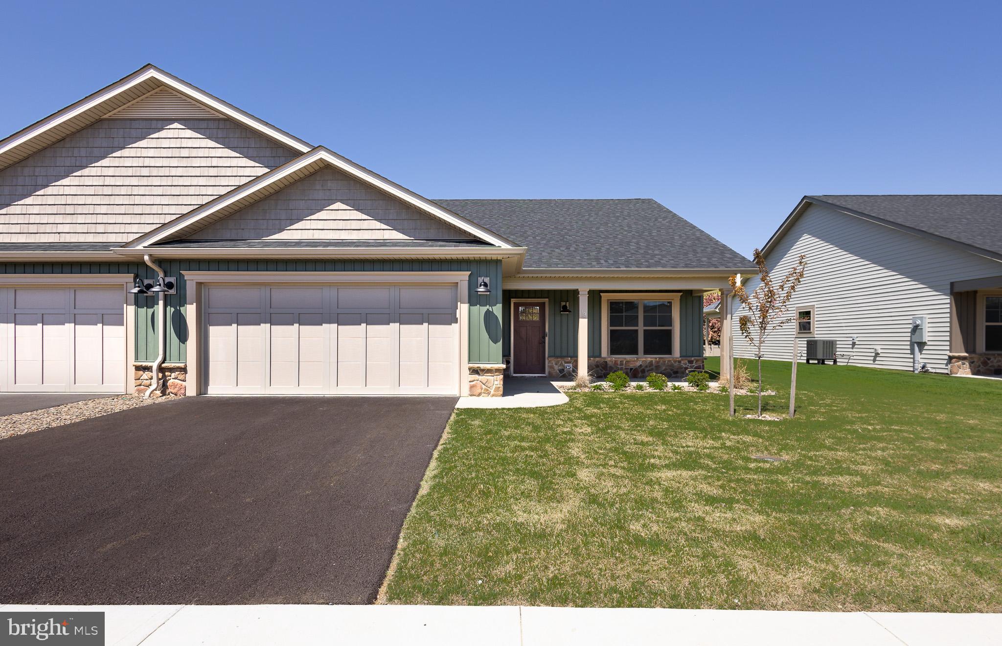 Construction of this home is complete! Pictures are of the actual home and finishes. Welcome to The Villas at Warm Springs - Berkeley County's newest 55+ Community. This quaint community is made up of only 14 Villa homes and offers a peaceful setting with sidewalks throughout. It is conveniently located close to shopping, restaurants, medical facilities and has easy interstate access. Mowing of your lawn, curbside trash pickup, road maintenance and snow removal of your driveway, sidewalks and the roads are all included as part of your HOA dues! All villas come standard with a beautiful ceramic tile zero barrier Owner’s Shower, matte black lever door handles and fixtures, architectural grab bars in the Owner’s Suite bathroom and quartz or granite countertops throughout the kitchen and bathrooms. Enjoy the ease of mobility with 36" doorways, no step thresholds and LVP throughout the main level. A large laundry room with a sink is located immediately outside of the Owners Suite bedroom. These features provide low maintenance living so you can enjoy accessibility throughout your new home. This particular villa also includes a bonus room upstairs with a 3rd full bathroom, a large walk-in closet and a wet bar with a mini fridge – perfect space for guests, an office, library, movie room or a craft room! The yard has been finished with lush sod, river rock landscaping and low maintenance shrubs. Construction in the neighborhood is nearing completion. Several homeowners are already enjoying their new homes in The Villas at Warm Springs, stop by and see if this home would be the right move for you!