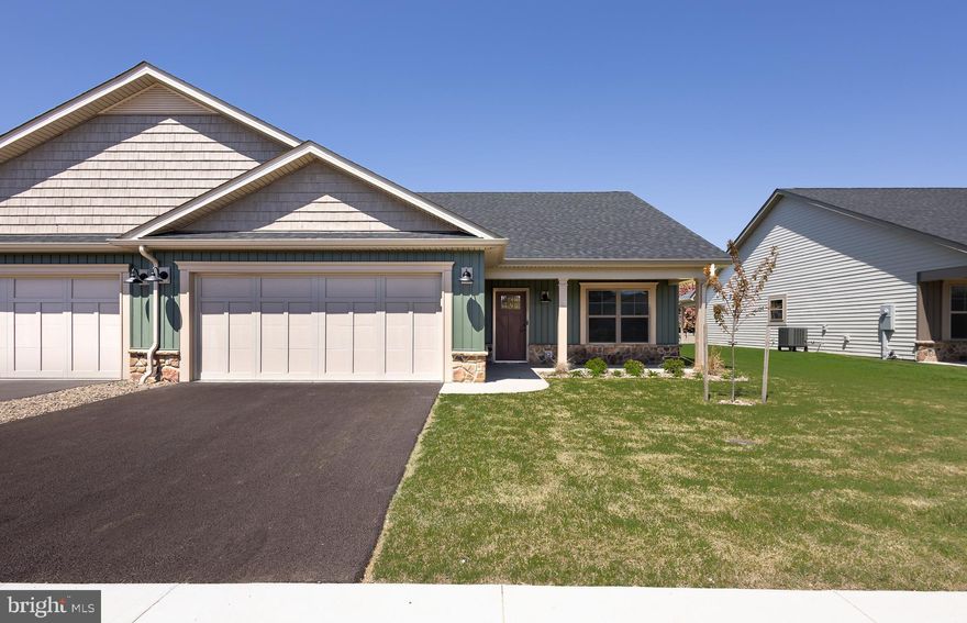 Construction of this home is complete!  Pictures are of the actual home and finishes.  Welcome to The Villas at Warm Springs - Berkeley County's newest 55+ Community.  This quaint community is made up of only 14 Villa homes and offers a peaceful setting with sidewalks throughout.  It is conveniently located close to shopping, restaurants, medical facilities and has easy interstate access.  Mowing of your lawn, curbside trash pickup, road maintenance and snow removal of your driveway, sidewalks and the roads are all included as part of your HOA dues!  All villas come standard with a beautiful ceramic tile zero barrier Owner’s Shower, matte black lever door handles and fixtures, architectural grab bars in the Owner’s Suite bathroom and quartz or granite countertops throughout the kitchen and bathrooms.  Enjoy the ease of mobility with 36" doorways, no step thresholds and LVP throughout the main level.  A large laundry room with a sink is located immediately outside of the Owners Suite bedroom. These features provide low maintenance living so you can enjoy accessibility throughout your new home. This particular villa also includes a bonus room upstairs with a 3rd full bathroom, a large walk-in closet and a wet bar with a mini fridge – perfect space for guests, an office, library, movie room or a craft room! The yard has been finished with lush sod, river rock landscaping and low maintenance shrubs.   Construction in the neighborhood is nearing completion.  Several homeowners are already enjoying their new homes in The Villas at Warm Springs, stop by and see if this home would be the right move for you!