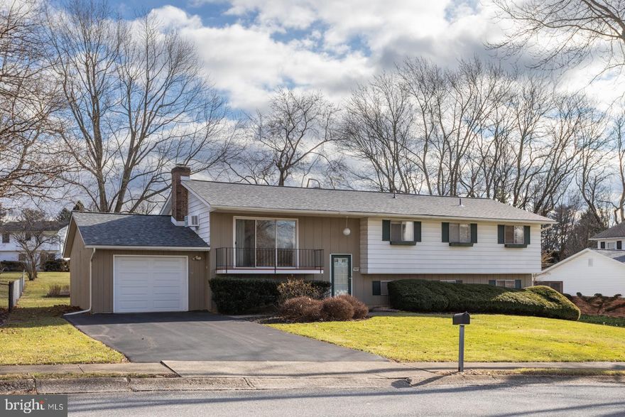 As you walk through the front door of this well maintained split level home in East Penn School District, you will find a main staircase with easy access to either levels of the home.  The top level of the staircase opens into the main living space with wonderful original hardwood flooring.  A unique kitchen overlooks the living space and staircase.  This section of the house has potential for an open floor plan concept.  The rest of the second floor contains four bedrooms, including a primary suite with walk-in closet, and a large tiled bathroom.  Heading down stairs,  you will find a cozy living room featuring a fireplace and a sliding glass door that opens out to the large back patio.  Adjacent to this is a half bath and laundry room with extra storage.  The other half of the bottom floor is dedicated to an in-law style suite.  This self-contained area includes its own bedroom, full bath, living room, and a well equipped kitchen with its own private entrance.  Lastly, this property includes a double wide driveway, single garage, and spacious front and back yard. Conveniently located near main roads and the quaint town of Emmaus.  Put this home on your tour today!  Priced to sell this home is being sold "as is" to settle an estate.