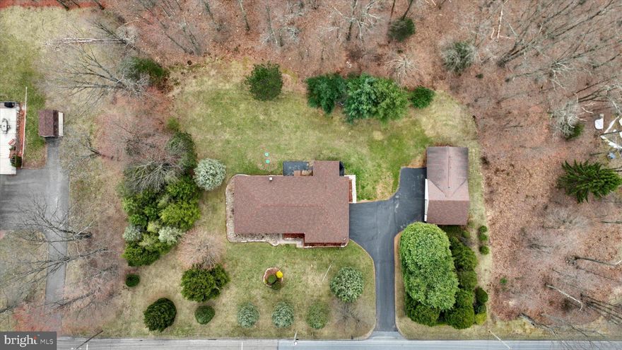 This RARE find envelops pride in ownership! Situated on a peaceful 2.28 acres, this Ranch home has it all! *Highest and Best deadline  8pm Thursday 4/17 * The home features 4 spacious bedrooms and 2.5 baths. The newly added primary suite features a contemporary tray ceiling, double closets,  en suite custom tile bathroom with radiant heat and double bowl vanity. The 25 handle kitchen features solid wood cabinetry and appliances are included. Hardwood flooring throughout most of the home. Don't miss the full basement which can easily be finished for more living area and includes half bath and laundry. Plenty of parking with 2-car attached garage, 1-2 car detached garage, and large paved driveway.  The detached garage also features a separate heated man cave/she shed/entertaining area. Just picture the summer picnics and campfires or watching wildlife from your back porch. Ductless air conditioning/mini splits (2), electric baseboard heat, 200amp electric, public water, onsite septic, new pex plumbing, septic 2023. This is one you don't want to miss!