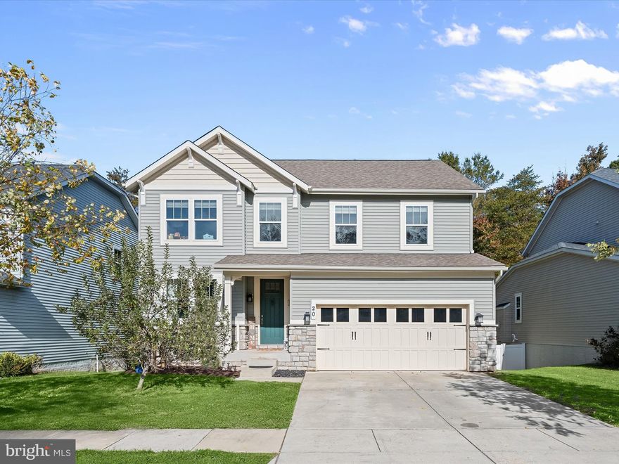 Set on a no-thru street in the waterfront access Tanyard Cove North community, this beautiful home offers 5 bedrooms, 3.5 baths, privacy, space, and thoughtful design. Backing to a wooded community area, the home provides year-round tranquility while still being part of a vibrant, amenity-rich neighborhood. Maintained by its original owners, this residence features bump outs on all three levels, creating generous living spaces and architectural interest.
The covered front porch welcomes you inside to the dining room on the left, flowing seamlessly to a spacious living room anchored by a cozy fireplace. The kitchen, adjacent to the living area, boasts 42-inch cabinetry, granite counters, an expansive island with breakfast bar, and a custom walk-in pantry with soft-close cabinetry. A sunroom off the kitchen with cathedral ceilings and large windows overlooks the wooded backyard, while an atrium door opens to the deck, bringing the outdoors in. Convenient garage access from the kitchen includes a custom drop zone for everyday items.
Upstairs, a spacious loft offers versatile living space. The primary bedroom features a boutique-style custom walk-in closet with built-ins and motion lighting, plus an en suite bath with double sink vanity and tiled shower. Three additional bedrooms share another full bath, and the upper-level laundry room adds practical convenience.
The walkout lower level would be a perfect guest or in-law suite that was finished in 2021; it includes a recreation area, fifth bedroom, stylish full bath, and kitchenette, along with a large storage room. Outdoor living is enhanced by a composite deck and a concrete patio that was added in 2021, matching the deck’s footprint. Recent updates include the refrigerator, washer, range hood, and upper-level carpet replacement. An attached two-car garage completes the home.
Tanyard Cove North offers resort-style living with a wide array of amenities designed for both relaxation and recreation. Residents enjoy direct water access with a private marina, boat ramp, kayak or canoe launch with convenient storage, and a picnic pavilion. The community also features a clubhouse with fitness center, gathering spaces, outdoor pool, play areas, a dog park, and scenic trails. The community is conveniently located near shopping centers, dining options, and major highways, providing both recreation and easy access throughout central Maryland.
This home combines privacy, space, and modern upgrades with an unmatched community lifestyle, offering a perfect setting for both everyday living and entertaining.