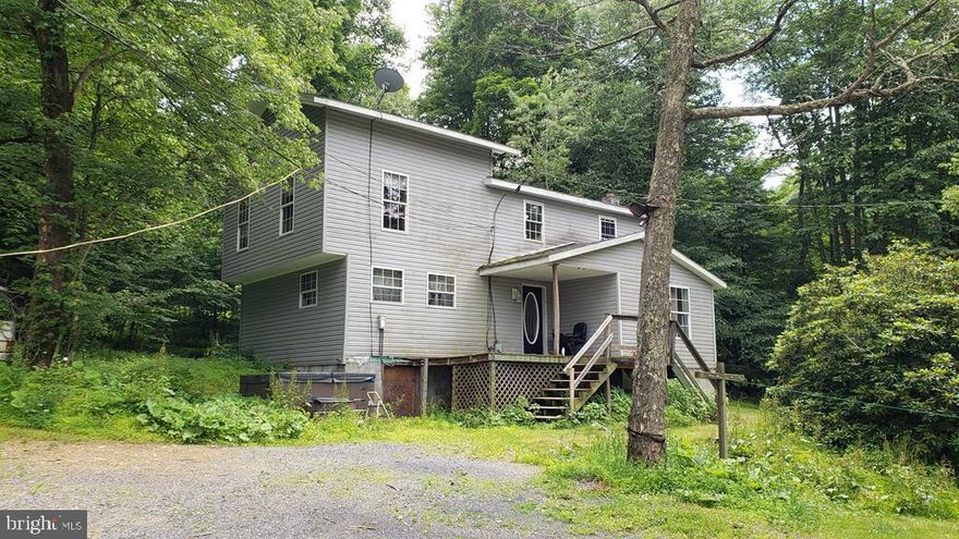 Adjoins Bald Eagle State Forest in the rear!  3 bedroom, 1 Bath,  2 story home on 17.38 Acres on New Lancaster Valley Rd. Home is in need of some work. Private Well and septic.  Oil hot water heat and mini spits. Pellet stove in living room for back up. Hot tub included. In Clean and Green. Where else will you get 17.38 accessible acres adjoining state land with a well and septic for this kind of money?