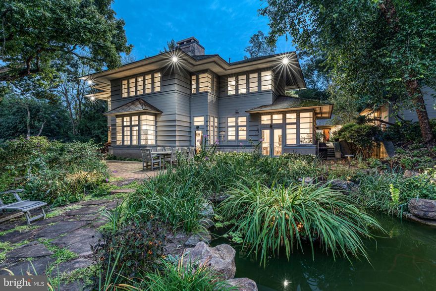 This spectacular home with a detached two-car garage is nestled on 2.15 acres, situated alongside Wissahickon Valley Park.  The location is not to be believed.  On the property is an equally well-designed guest house which we will describe in further detail below.  Drive up to this dream location at the end of Northwestern Avenue through a gated entrance.  On the main floor, the newly renovated kitchen boasts an oversized island with seating, custom Bulthaup cabinetry and countertops, abundant pantry storage, and Bosch appliance suite including a 6-burner range, hood vent, double oven and a built-in refrigerator and dishwasher.  The adjoining dining area and open living area features vaulted ceilings and a wood burning fireplace. There are views of the lush landscaped grounds, designed with special blooms in mind for every season. It is green as far as the eye can see.  This floor is complete with an ensuite, a 2-story foyer and a powder room.  Upstairs the master suite with vaulted ceilings, wood fireplace, built-in cabinets, and walk-in closet is nestled along the tree line with more incredible views.  The bathroom features a large soaking tub, a glass-enclosed shower and two separate water closets with vanities.  The 2nd floor is complete with another spacious bedroom and 4th bedroom/nursery/office.  The newly finished basement allows more living space in the home you'll never want to leave.  Currently set up as an entertainment room.   The laundry room with barn door and shelving is tastefully appointed.  Outside enjoy the slate patio, a  magnificent koi pond and several tiers of landscape, beyond which the hills roll into the Wissahickon Valley Park.  The guest house details:  built in 2018 and features a new kitchen with quartz countertops and stainless steel appliances, a spacious bedroom with vaulted ceilings and bathroom with a double sink, floating vanity and a glass enclosed walk-in shower.  It also has sliding glass doors leading to a crushed stone patio overlooking the lush green landscape.  **The # of bedrooms and bathrooms includes the bedroom and full bathroom in the guest house.  The guest house is 840 sq ft.  The property has a Phila zip code but is located in Springfield Township.