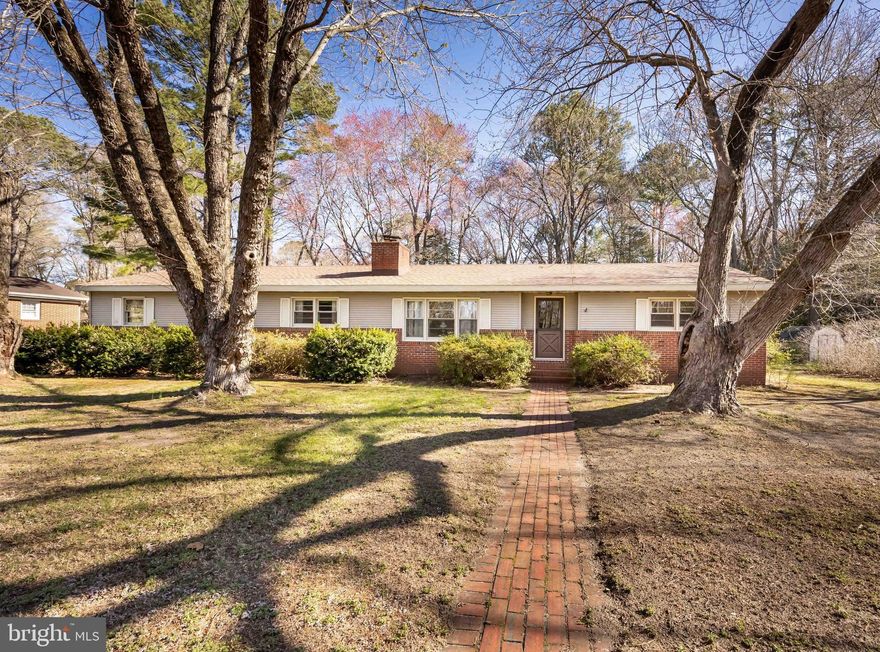 Welcome to 213 Morris Dr! This adorable 3 Bedroom 1.5 bath beauty is just over 1700 SF. There is a large living room and a separate den for ample day to day living space that feature back to back fireplaces. The kitchen is large enough to whip up meals for entertaining and an additional dining room give plenty of space to enjoy them. There are three ample sized bedrooms with a full bath at the end of the hall. Added bonuses are the mudroom area with a half bath as you enter the back door. An attached workshop and one car garage are great for those projects and extra storage needs. When it's time to unwind a bit, you can do so on the screened in back patio or fire up the grill on the open deck for your enjoyment. The roof is less than 1 year old! There is also a handicap accessible ramp off the back of the house and a blacktop driveway for easy access. Don't let this one slip away!!!