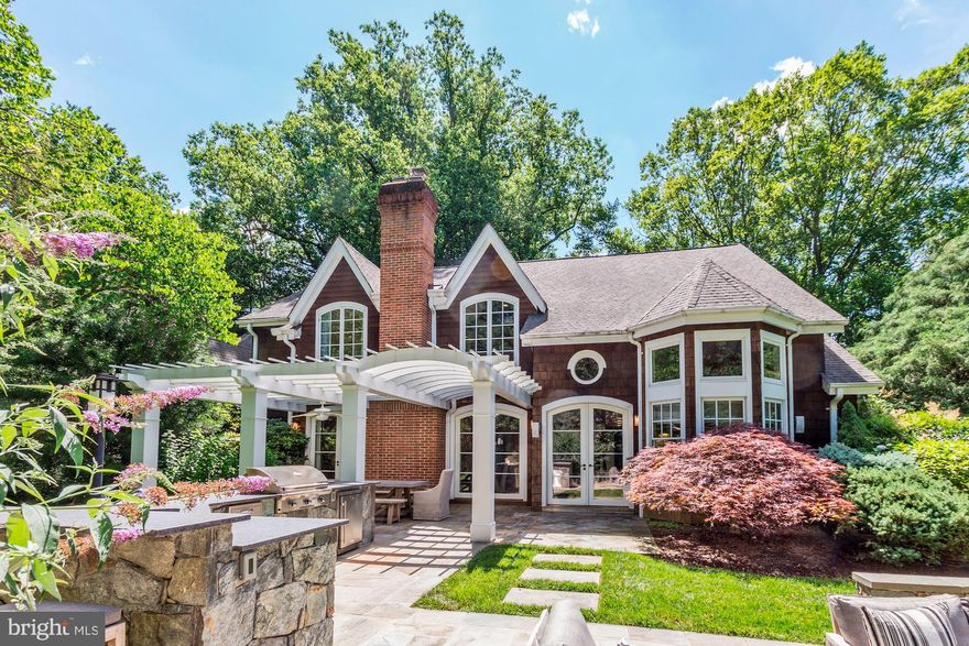 Prepare to be wowed by this exquisite and professionally decorated Craftsman style home with numerous seller improvements!  A five bedroom, four and a half bath beauty, including a luxurious main level master suite, is sited on a private wooded lot, located on a quiet cul-de-sac within minutes of I495 & River Road, and conveniently located to downtown Bethesda.  This handsome home has a highly functional floor plan and includes spectacular architectural details throughout   vaulted & cathedral ceilings, arched doorways, columns, niches, and built-ins galore.  A gourmet kitchen features stainless Thermador, Sub-Zero, and Bosch appliances, granite, silestone, subway tile, island seating, breakfast area, and opens to a cozy family room with an incredible bench seat window overlooking the backyard. Additional features include a dramatic two-story foyer, a chic living room centered around a gorgeous limestone fireplace, a sophisticated and intimate dining room, dual staircases, and two multifunctional lofts. The lower level boasts a well-appointed recreation room, fireplace flanked by built-ins, custom bar with a beverage cooler, and a large mudroom accessed by the 2-car garage.  The private backyard has been enhanced with a custom-built, stone gas fireplace and outdoor kitchen, bar, grill, lounge seating area, and an arched Pergola.  Extensive hardscape, landscape lighting, an irrigation system, and a delightful front porch, perfect for those warm summer evenings, round out the exterior amenities.  Seller is offering the option to purchase this house fully-furnished making this a turnkey, move-in ready opportunity.  Buyers looking for an extraordinary property to call HOME need not look any further!