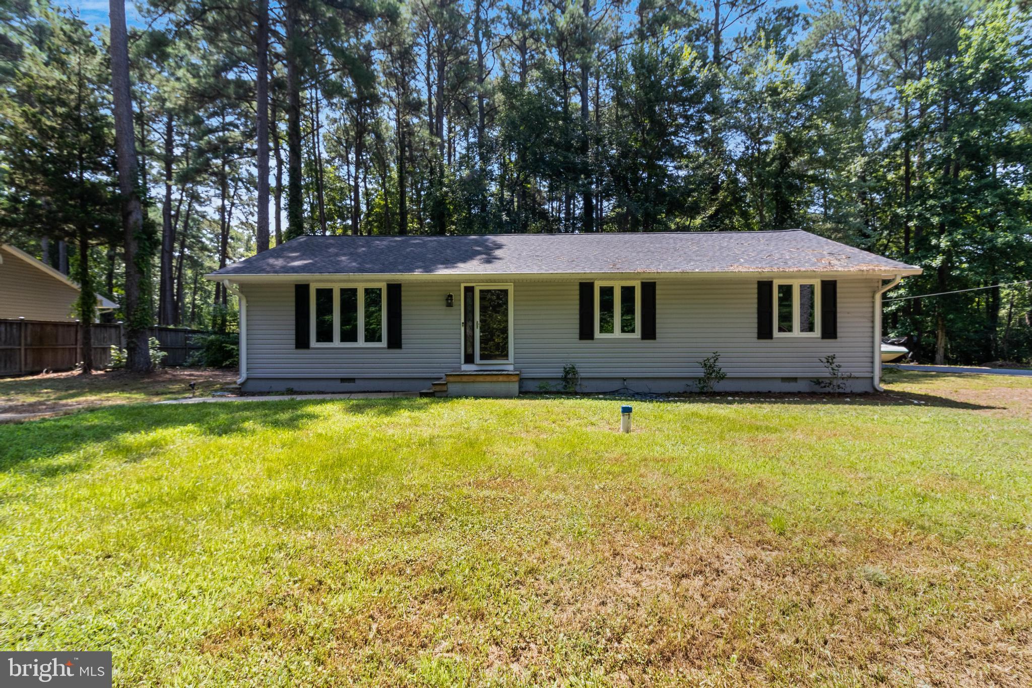 This beautiful one-level home with 3br/2ba is located South of Gate 3 and close to Elm's Beach in Lexington Park. New siding, windows, washing machine and carpet installed in 2020. New water heater and well with filtration system installed in 2019. New 30-year roof with 6" gutters installed 2017. Crawl space is encapsulated, with R-30 insulation. Custom upgrades in the hall bathroom include cast iron soaking tub, and marble floor. Pella front door and Andersen Frenchwood gliding door leading out to the back deck. Plus, enjoy a gorgeous view of the Bay on your drive down to the property. You'll fall in love with this home! Don't miss out!