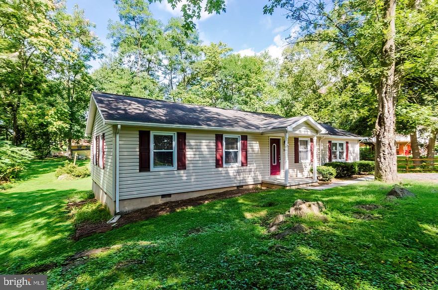 All dressed up and ready! This great ranch style home offers 3BRs, 1 1/2 baths, updated kitchen, large family gathering room, mud/laundry room and all maintenance free flooring.  Home has been updated over time with replaced roof, siding, windows, HVAC and large rear deck. Nice level partially wooded lot. Adorable and affordable!
