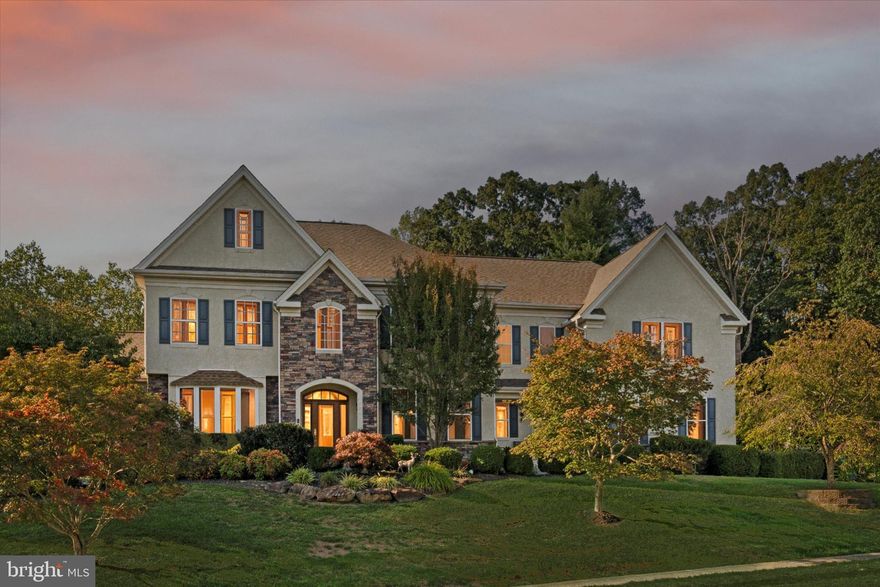 Welcome to 2001 Grenoble Road, an exquisite open floor plan 4-bedroom, 4.5-bathroom residence with 5 separate zones for superior HVAC efficiency, tucked away on a quiet street in one of Romansville’s most desirable neighborhoods. Enjoy the rolling hills of the area while still being close to modern conveniences and in the award-winning Downingtown School District. This custom home is filled with architectural details, luxury finishes, and abundant natural light from its many large windows. Step inside through the stained-glass front door and into the grand two-story foyer with a sweeping floating staircase and decorative columns. Gleaming brand-new hardwood floors flow throughout the main level, leading to a spacious formal dining room, a two-story great room, and a stunning piano room. The oversized kitchen features granite countertops, a large center island, double ovens, a gas cooktop, recessed lighting, and ample space for entertaining in the large breakfast room addition. Just off the living room is a conservatory with its own zoned HVAC and beautiful stained wood beamed A-frame ceiling surrounded by windows, offering a warm gathering space. Upstairs, the luxurious primary suite boasts a tray ceiling, a large adjoining sitting room with plantation shutters, and a spa-like bathroom with upgraded Moen plumbing fixtures, bronze shower head, separate bronze shower with Jacuzzi tub, dual vanities, makeup station, walk-in shower, recessed dual medicine cabinets, and upgraded bronze lighting fixtures. A princess suite with private bath, two additional Jack-and-Jill bedrooms, and a large comfortable loft with recessed lighting and its own electric glowing fireplace complete the upper level. The very large finished basement expands the living space with a full bathroom featuring a walk-in tiled shower and granite vanity, plus a versatile separate area perfect for a gym, recreation room, or media space.  Outdoor living is equally impressive with Trek decking overlooking the private backyard with beautiful tree-lined views, a brick patio with built-in gas fireplace and fire pit, and breathtaking mature landscaping enhanced by accent lighting.  Additional highlights include a three-car garage, 5-zone HVAC system, custom crown molding, recessed lighting throughout, new water heater, and unique design touches that set this home apart.  This remarkable property offers timeless elegance, modern comfort, and plenty of space for everyday living and entertaining.