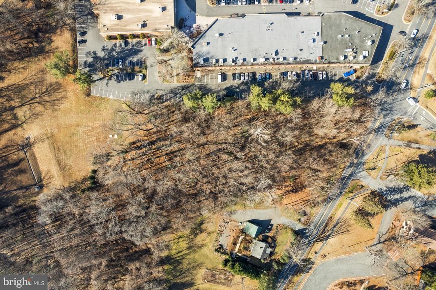 Ideally located adjacent to the Village center, this level, 1.95 acre site provides an exceptional opportunity to build a new residence in the heart of prestigious Great Falls.  Surrounded by mature trees and numerous specimen plants, the site affords exceptional privacy and convenience.  . A preliminary feasibility study is included in the Documents section of the listing providing an overview of the site and Fairfax County building requirements.  The adjoining 1.00 acre parcel located at 9813 Georgetown Pike is also available, creating an opportunity for a total of almost 3 acres in one of the region's best locations.