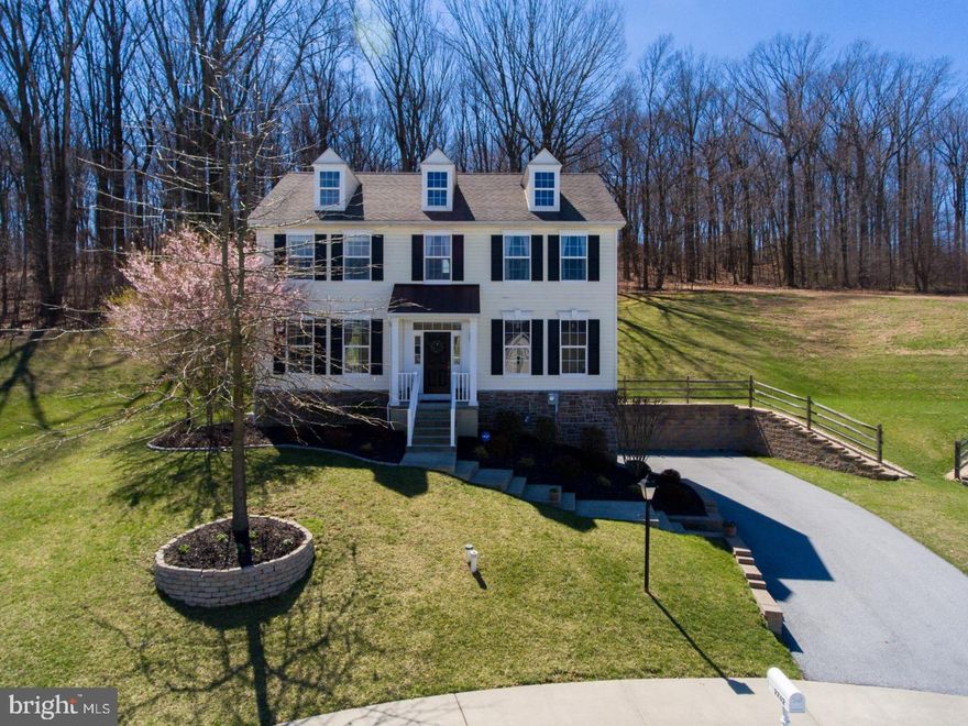 This Colonial home in the Reserve at Bailey Station is situated on a picturesque cul-de-sac with a wooded backyard view.  A convenient location with easy access to Rte 30, the Thorndale train station, and numerous shops & restaurants is beautifully combined with the "tucked away" feeling of an attractive lot that has plenty of curbside appeal and charming backyard views. From the covered front entry, you'll step inside to an immaculate home that's ready to become your own personal oasis. A soothing paint scheme throughout and architectural details such as crown molding, trim-work, and a transom window over the front door lend an air of sophistication from the very first step, while the circular flow of the entire first floor makes this home an excellent choice for entertaining or quiet relaxation. A pleasant, welcoming living room with neutral carpeting leads seamlessly into the heart of this home where you'll enjoy a light-filled family room with a gas fireplace and a slider to the backyard deck ? all of which is completely open to the kitchen of your dreams. Spacious & beautifully laid out, the kitchen features white cabinets with crown molding, stainless steel appliances, a pantry cabinet, granite counters and warm hardwood flooring. You'll also enjoy a formal dining room just off the kitchen which completes the circular flow of the first floor. Upstairs are three bedrooms including a decadent master suite with a tray ceiling, a coveted sitting room for your personal "down time" and a beautiful en suite master bath with a large soaking tub with tile surround, a separate shower, and his & hers sinks. The two hall bedrooms are both good sized with ample closet space and they share a nicely finished hall bath with cultured marble vanity and tile floor. In addition to all of this is a backyard oasis that equals love at first sight. A large deck with vinyl rails and a covered pergola make this a great space for entertaining. Or, sit back and relax with your morning cup of coffee while enjoying the wooded backdrop and plenty of grass sloping gently to a flat, open side yard. Inside and out, this home beckons with versatile and welcoming spaces. Inquire today!