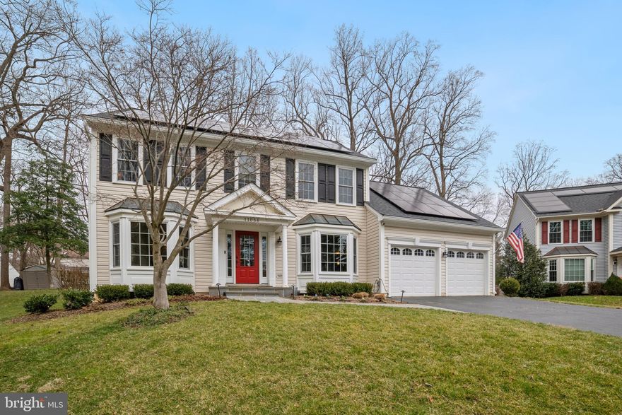 Beautifully maintained and updated, this is the home you have been waiting for! Spread out and enjoy over 4200 sq ft of living space, with open floorplan and comfortable gathering areas for everyone on the main and lower levels. A gracious hardwood entry foyer welcomes you with library/ office to the right and inviting dining room with bay window to the left. Kitchen is ultra spacious and light with custom white cabinets, granite counters, stainless appliances, and recently replaced decorative lighting fixtures.  This well-designed space is sure to delight the designated chef, who will never be far from the social scene with the vaulted family room and brick fireplace just beyond! Steps away is a comfortable sunroom with vaulted ceiling, ceramic flooring, separate HVAC, and multiple windows for views of the deck and scenic backyard. Venture downstairs to a fully finished basement featuring a large recreation room with snack bar and mini kitchen area, bedroom, full bath with dual access, and extra spaces for exercise and air hockey.  Closets with shelving are plentiful throughout the lower level for all your storage needs. The upper level boasts a primary suite with cathedral ceiling, huge walk-in closet, and adjoining bath. Three additional bedrooms plus an updated hall bath complete this level. Exterior landscaping recently redesigned with new shrubs, accent lighting and sprinkler system. Many recent updates include: most windows, all doors, exterior security cameras, solar power with 30-year warranty, 240 volt /60 amp Tesla electric vehicle charging station, carpet and fresh paint. Experience all the comforts of home in this beautifully appointed property along with the savings of solar and the convenience of an exceptional southern Howard County location. Major routes 29, 95, & 32 are all nearby and provide easy access for the Baltimore, Washington, or Annapolis commuter. Nature surrounds with Scotts Landing Recreation area within walking distance. Enjoy peaceful moments kayaking, hiking and observing abundant wildlife. Plan to see this exceptional home today and make it your new address!