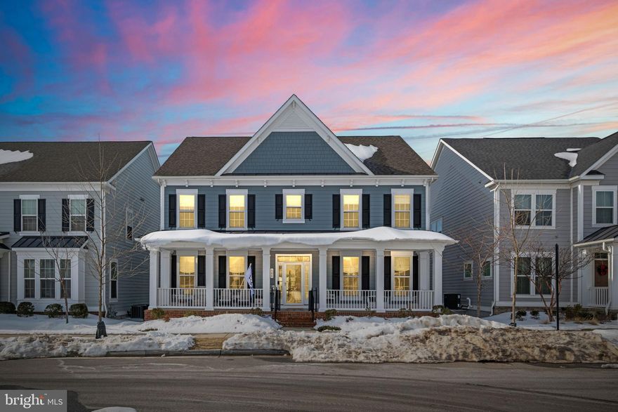 **Welcome to this stunning 5-Bedroom, 5.5-Bath Canton Model featuring nearly 5,000 square feet of beautifully finished living space in the highly sought-after community of Greenleigh at Crossroads in Middle River. Built in 2021 by Williamsburg Homes, this thoughtfully upgraded home blends luxury, functionality, and modern design in one exceptional package.

From the moment you arrive, the expansive composite front porch sets the tone. Step inside to a light-filled foyer where French doors open to a versatile main-level bedroom with private ensuite bath — ideal for guests, a home office, or even a convenient main-level primary suite. Opposite, the formal dining room with crown molding provides the perfect setting for hosting memorable gatherings.

At the heart of the home, the fully upgraded gourmet kitchen impresses with a massive center island featuring a built-in microwave and farmhouse sink, stainless steel appliances with double wall ovens, gas cooktop, quartz countertops, subway tile backsplash, Butler’s pantry, prep area, recessed lighting, pendant fixtures, and stunning 42” white cabinetry. The adjoining eat-in area flows seamlessly into the spacious family room, complete with recessed lighting and a cozy gas fireplace. Durable, waterproof engineered vinyl plank flooring runs throughout the entire main level. A convenient mudroom with garage and deck access plus a stylish half bath complete this level.

Upstairs, you’ll find four generously sized bedrooms, including a luxurious primary suite showcasing tray ceilings, new hardwood floors, a large walk-in closet, and a spa-inspired bath with granite dual vanities, ceramic tile flooring, and an oversized frameless glass shower with built-in seating. One secondary bedroom features its own private full bath, while the remaining two share a spacious hall bath. A utility room with laundry tub and front-loading Whirlpool washer and dryer adds everyday convenience.

The fully finished lower level is designed for entertaining, offering a beautifully appointed wet bar with ample cabinetry and pull-out shelving, recessed lighting, a full bath, and abundant storage space. Whether hosting game day or movie night, this level delivers flexibility and function.

Outdoor living is just as impressive. Relax or entertain on the rear composite deck overlooking the fully fenced backyard with hardscaped patio and firepit. Additional exterior features include vinyl fencing, front porch gate, and negotiable hot tub.

Beyond the extensive builder upgrades, the seller has added thoughtful enhancements including custom shades, upgraded lighting fixtures, ceiling fans, fresh paint throughout, finished basement bath, hardwood flooring in the primary suite, storm door, hardscaping, and more. Dual-zone heating and cooling ensure year-round comfort.

Located directly across from open common ground, this home also offers a 2-car garage plus street parking. Residents of Greenleigh enjoy resort-style amenities including an outdoor pool, clubhouse, fitness center, dog parks, playground, and walkable access to local coffee shops and eateries. You’re just minutes from The Avenue at White Marsh, Gunpowder Falls State Park, and convenient MARC Train access for commuters.

This exceptional home truly checks every box. Schedule your private showing today and explore the 3D tour — this is one you do not want to miss.