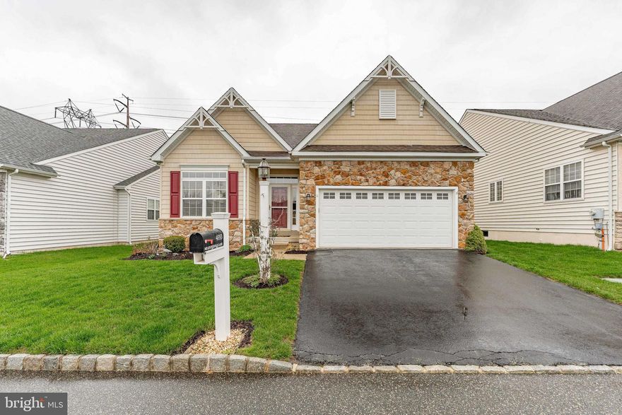 Welcome to 4353 Meadowridge Lane, a beautifully designed 3-bedroom, 3-bathroom home in the sought-after 55+ community of The Meadows at Skippack in Collegeville. Not only does this home offer a comfortable and spacious living environment, but the community provides a wealth of amenities, including a community walking trail right outside your door, with the serene 20-mile Perkiomen Trail just beyond. This home offers a two-car garage, a spacious two-car driveway, and a welcoming foyer with tile floors that lead into the open-concept living and dining area. With plush carpet, crown molding, and large windows, this space is bathed in natural light. The convenient laundry room features luxury vinyl plank flooring, built-in cabinets, a washer and dryer, and a utility sink. The first full bathroom on this level includes tile floors and a tub/shower combo. The first bedroom, ideal as a guest room or office, has carpeted floors and a double-door closet. The kitchen is a highlight, featuring luxury vinyl plank flooring, a central island with seating, a double sink, stylish tile backsplash, and a walk-in pantry. It flows seamlessly into the breakfast room and the family room, which boasts soft carpet, a gas fireplace, a ceiling fan, vaulted ceilings, and access to the sunroom. This bright and airy space has tile floors, vaulted ceilings, and large windows overlooking the backyard, with a sliding door that leads to the back deck. The spacious primary bedroom offers plush carpeting, vaulted ceilings, ceiling fan, two regular closets, and a walk-in closet. The en-suite bathroom is a true retreat, with tile floors, a water closet, a tile shower, a soaking tub, and a double vanity. Upstairs, the cozy sitting room has carpeted floors, a ceiling fan, and access to the attic for additional storage. The third bedroom, also carpeted, features two closets and a ceiling fan. The third bathroom includes tile floors and a shower with built-in seating. The unfinished lower level is a walk-out basement, offering plenty of space for customization. It also houses the home’s utilities and a workbench. Enjoy the community’s inground pool, clubhouse with a fitness center, and the convenience of being just a short drive from Historic Skippack Village, shopping, dining, and grocery stores. With easy access to major highways, traveling is a breeze. Don’t miss your chance to make 4353 Meadowridge Lane your new home!