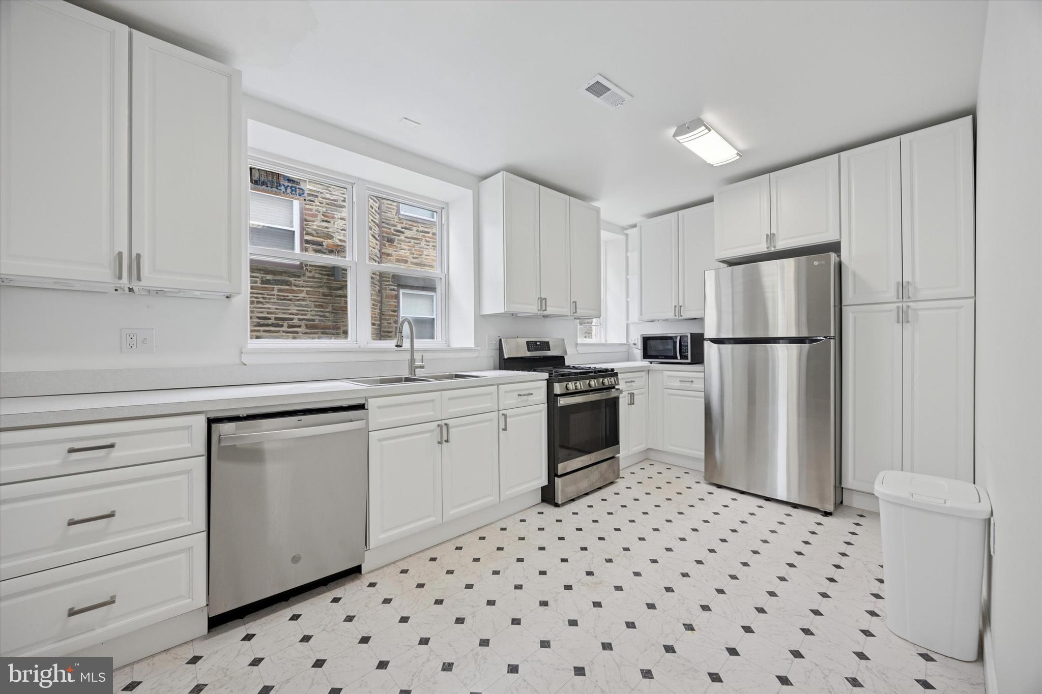 Welcome to 2283 N 51st St – A Beautifully Renovated Home in the Heart of Wynnefield, West Philadelphia
This charming property is centrally located in the desirable Wynnefield section of West Philadelphia. As you arrive, you're welcomed by beautifully maintained landscaping that leads to a shared driveway and the front entrance. Step inside and feel the warmth of this fully remodeled interior. The first floor features plush wall-to-wall carpeting that adds comfort and coziness throughout the space. The open-concept layout immediately invites you in, creating a seamless flow from room to room. The eat-in kitchen is a true highlight, featuring stunning quartz countertops, soft-close cabinetry, recessed lighting, and an abundance of natural sunlight. Just off the kitchen, you’ll find a convenient laundry room and half bath to the right, and the dining room to the left, accessed through charming saloon-style doors. To the right of the dining area is a spacious living room, perfect for entertaining or relaxing. Adjacent to the living room is a bright and airy sunroom – ideal for indoor lounging or hosting guests. Upstairs, the second level offers four generously sized bedrooms and two full bathrooms. The primary suite includes its own private ensuite bath with a beautifully upgraded walk-in shower. French doors in the primary bedroom open to a walkout area on the front roof, offering a unique outdoor retreat. Additionally, a second door leads to a small balcony that adds character and charm. The suite also includes two large closets for ample storage. Each of the secondary bedrooms features spacious closets and gorgeous hardwood floors, which continue throughout the second-floor hallway. With just a few personal touches and finishing updates, this house could easily become your dream home. Don't miss out on the opportunity to buy a home that has high potential and offers a ton of equity.
This is an As-Is/Where Is Sale.