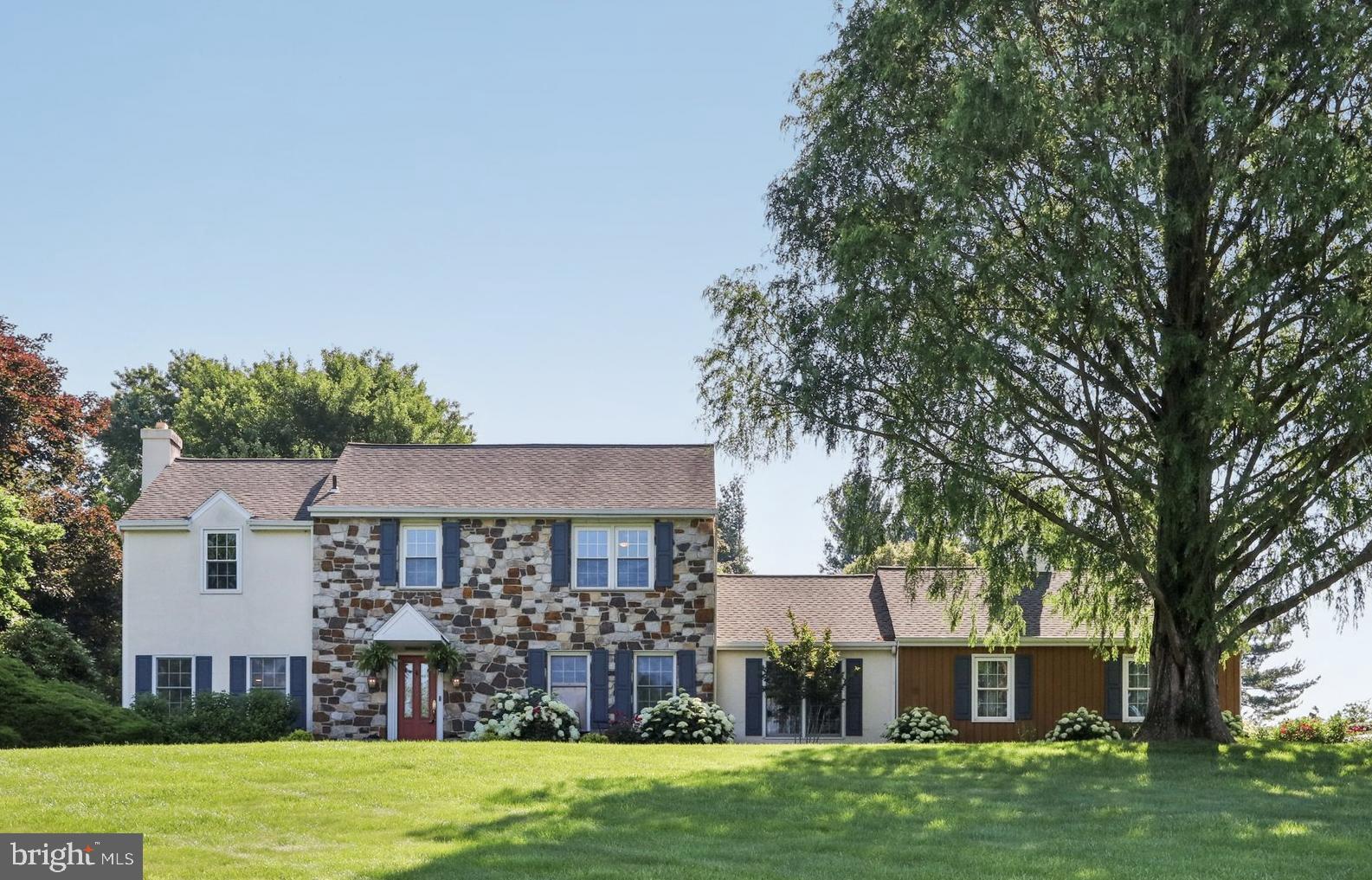 Welcome to 1118 Dorset Drive, a beautifully updated colonial on 1.2 private acres in the award-winning Unionville-Chadds Ford School District. This 4-bedroom, 2.5-bath home blends timeless charm with thoughtful updates, offering the perfect mix of comfort, style, and space. Inside, you’ll find warm hardwood floors, classic millwork, and a fantastic flow. The formal living and dining rooms are ideal for holidays or everyday use, and the cozy living room fireplace adds character. The heart of the home is the show-stopping kitchen addition featuring a large island, custom hardware, a reclaimed wood beam, and a 16-foot wall of sliding doors that open to a fabulous stamped concrete patio. The family room with wood-burning fireplace is perfect for casual nights in, and a tucked-away office and stylish mudroom make daily living easy. Upstairs, four spacious bedrooms include a bright and airy primary suite with two walk-in closets, a dressing area, and an updated ensuite bath. The finished basement with egress adds flexible living space, while the lush backyard, patio, and professional landscaping offer a private outdoor escape.
Just minutes from shops, schools, and major routes, this one checks all the boxes. Move right in and enjoy!