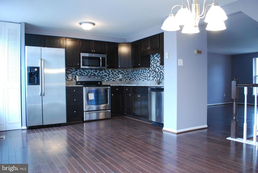 Elegantly renovated 3-Lvl T/H w 3.5 updated baths; Granite kitchen, New Cabs + upgraded new hardwood flrs + SS appliances; Professionally painted; Spacious Eat-in-Kitch + sunlit living rm; 2 Mbdrs w new paint & carpets + 2 luxury baths;  fully fin lower level w spacious  Bonus  Rm (3rd Bdr?), Luxury Bath, laundry & storage; Fenced yard; Convenient to BW Pkwy, Univ of MD, I-95, 495, Wash DC & Balt.