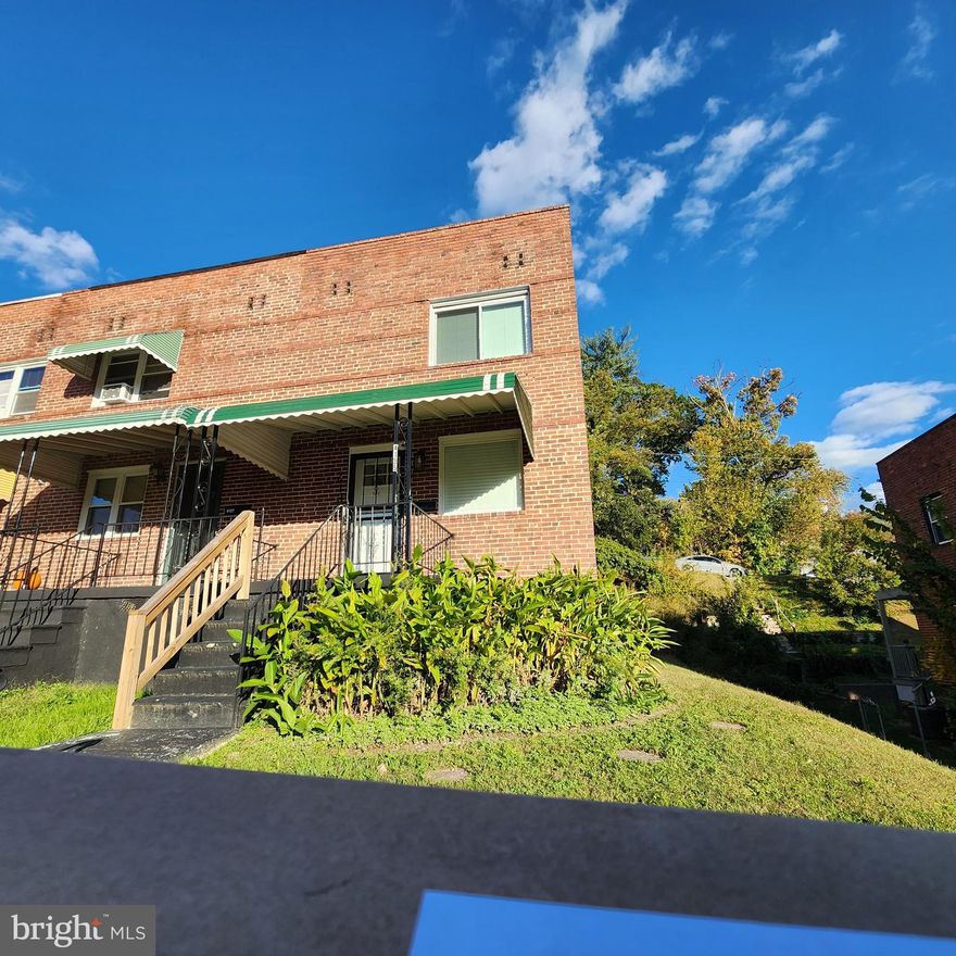 Discover this inviting 3-bedroom, 2-bath end-of-row home in the historic Original Northwood community! This Federal-style brick townhome features an open living space with a 90% finished basement, adding substantial additional room. The end-unit location provides extra natural light and a private driveway for convenient parking. Enjoy central A/C, natural gas heat, and a rear basement entrance for added versatility. The three-level layout provides excellent separation of living spaces, with all bedrooms located on the upper level. Located on The Alameda with access to parks, shopping, and dining. This is an exceptional opportunity in one of Baltimore's most sought-after neighborhoods. Immediate possession available with flexible financing options.