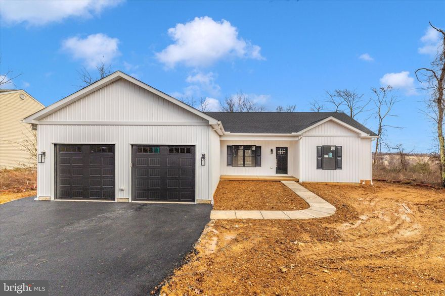 Modern comfort defines this brand new 3-bedroom, 2-bath rancher offering almost 2,000 square feet of one-level living in Carroll Valley. The home features a desirable split-bedroom layout and an open concept main floor with durable LVP flooring throughout. The kitchen includes granite countertops, stainless steel appliances, 42-inch white cabinets, and a spacious seven-foot center island. Granite counters are also featured in both full bathrooms. The private primary suite offers a large walk-in closet and an en-suite bathroom with a walk-in shower and a free standing soaking tub. The wide open basement is ready for your finishing ideas, complete with a rough-in for a full bathroom and a walkout exit, making it an excellent option for future living or entertaining space. Additional features include an oversized attached garage. Conveniently located near Liberty Mountain Resort for skiing and golf, local parks, and historic Gettysburg, this home provides easy access to year-round amenities and recreational activities.