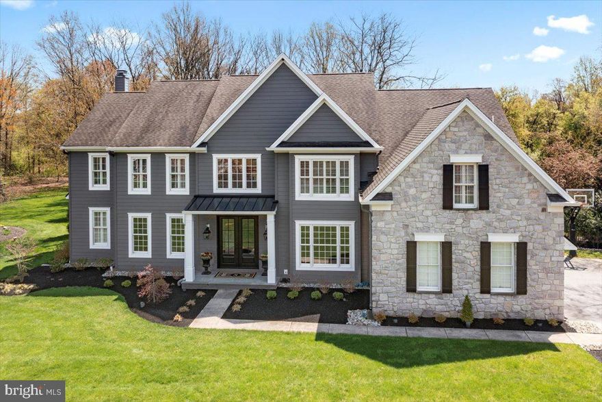 **MULTIPLE OFFERS HAVE BEEN RECEIVED.  ALL OFFERS DUE FRIDAY 9PM 4/26.  
This magnificent home is nestled on a park-like 0.43 acres in the prestigious Buckingham community of Reserve at Holicong. The grand 2-story entrance foyer features double light doors opening to reveal an impressive curved staircase with chandelier lift. Throughout the home you will find plantation shutters, box molding, rich wood floors, and extravagant woodwork adorning every room. The living room was recently outfitted with custom built-in bookcases. Crown and picture frame molding continues across the hall into the dining room (currently the billiards room) providing a picturesque backdrop for hosting gatherings of any size. The expanded kitchen is a chef's dream, tastefully remodeled with new custom cabinets, leathered granite and stylish travertine tile, reverse osmosis water filtration, and both pendant and recessed lights to illuminate every surface. A large center island houses a built-in microwave and offers seating. Top-of-the-line appliances include a Sub-Zero refrigerator, 6-burner Wolf cooktop with hood, 2 dishwashers, double wall ovens and warming drawer, and undercounter KitchenAid wine cooler. Adjacent to the kitchen, a sunny breakfast area fills with light from 2 stories of windows and sliding glass doors that open onto the outdoor living areas. Enjoy the sounds of nature or choose your background music through the Bose surround sound speaker system also streaming in the family room, kitchen, living room and outside. Here, the patio with built-in grill is perfect for al fresco dining and entertaining. The fenced yard has been professionally landscaped and features an inviting solar-heated inground pool. Back inside, the family room has hardwood flooring with a cozy gas fireplace, coffered ceiling, and a wall of sunburst windows. A private study with Amish wood floors offers a serene retreat for work or relaxation. The laundry room was expanded and remodeled to include travertine tile flooring, cabinetry, granite counters with sink, and outside access. Two powder rooms are conveniently located on the main level. Hardwood flooring runs upstairs in the hallway, primary bedroom and closet, and 3 other bedrooms. Double doors open into the sumptuous primary bedroom suite, with a vaulted and coffered ceiling in both the bedroom and private office, and 2 generous walk-in closets with organizers, and an ensuite bath. The bathroom was recently remodeled with a seamless glass and tiled shower, and large vanity with double sinks. A Prince/Princess suite is complete with its own ensuite bathroom, while three additional bedrooms share a recently modeled bathroom. The full basement offers plenty of storage space. So many upgrades and improvements including Hardie siding exterior and so much more! Situated in the award-winning Central Bucks School District with many private schools in the area. Just minutes from downtown Doylestown for dining, shopping, or cultural events. Don't miss the chance to immerse yourself in the exceptional lifestyle this residence has to offer, right in the heart of Bucks County. Make your appointment today!  Showings begin 5:00 pm  on Thursday 4/25 at the Open House.