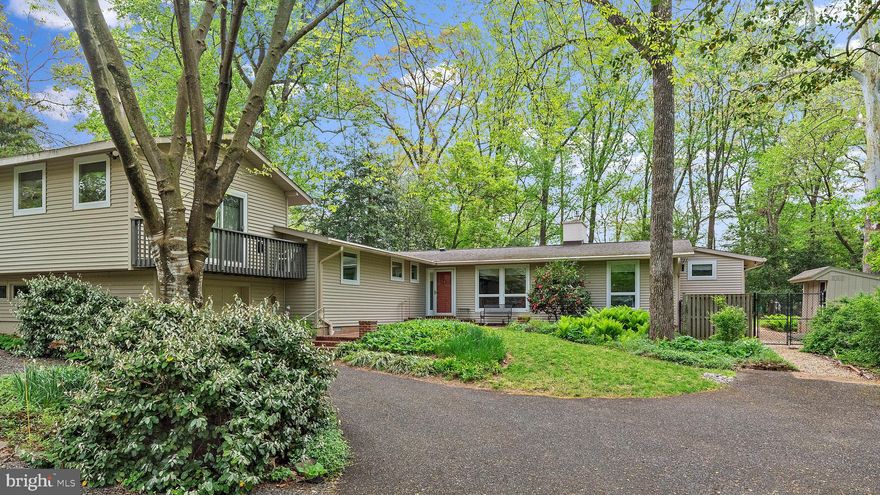 This charming Ranch-style home is nestled in a serene, natural setting that offers privacy in this lush environment.  With its beautiful wood floors throughout and expansive windows that invite an abundance of light, this residence is warm and welcoming.
The open floor plan effortlessly connects living, dining, and kitchen areas, making it perfect for both everyday living and entertaining. Enjoy seamless transitions to the brick patios or decks where you can enjoy the surrounding greenery in a private outdoor setting.
Featuring three spacious bedrooms, two and a half bathrooms, a cozy Living Room, a versatile Great Room, and additional office spaces, this home offers a range of comfortable and versatile living spaces. Additional amenities include a one-car garage, extra parking spaces, generator, propane stove, brick patios, and well built, convenient shed.
Ideally situated, this home offers easy access to Historic Annapolis, local schools, shopping, dining and transportation routes. Enjoy the ease of being close to everything you need while still benefiting from a tranquil and private setting.