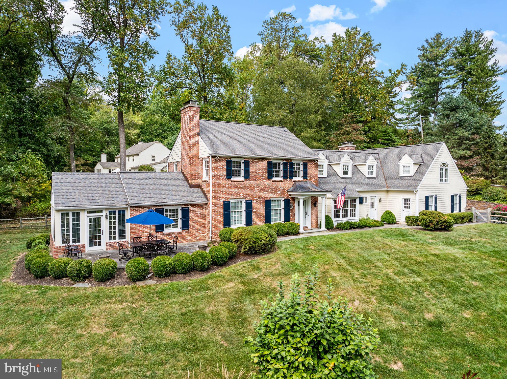 Welcome to 182 Grubb Road, a classic brick and James Hardie siding Colonial home elegantly situated on a breathtaking 2.5-acre lot with pool in Willistown Township. This meticulously maintained and updated home offers 4 bedrooms and 4.5 bathrooms, spanning 4300 SQ FT of thoughtfully designed living space with three fireplaces and gleaming hardwood floors that continue throughout. Enjoy the beauty of the property from the front or back flagstone patios, the pool with a newly expanded deck or the stunning sunroom. The E.B. Mahoney built addition offers an eat-in kitchen with charming brick fireplace feature wall and sliding glass doors to the rear patio, mudroom with tile floor, laundry and a full bath (perfect for when the pool is open), a second front entry door, an oversized three car garage and a second staircase to the stunning Primary Suite.
A flagstone path and inviting front porch entry lead into the Foyer with Home Office on the right with custom built-in cabinetry and shelves. On the left is the living room with custom built-ins flanking the gas fireplace that flows into the dining room with a triple window overlooking the rear property. To the right you will find a butler’s pantry, a large, custom outfitted coat closet, and a powder room before heading into the eat-in-kitchen with vaulted ceiling and feature window over the sink, white cabinetry and granite countertops, large island with seating, pantry closets, a wood burning fireplace and access to the rear patio. Completing this floor is a Family Room with third fireplace (gas) and door to the sunroom with cathedral ceiling and spectacular views of the property.
Venture upstairs to find four bedrooms all with custom outfitted closets, one with an updated ensuite bath, the second and third bedrooms share an updated hall bath. The Primary Suite is a true retreat with a sitting room, his and her custom outfitted walk-in closets, a vaulted ceiling and luxurious renovated bath with soaking tub, double sink vanity, glass enclosed shower and private water closet.
Outside, your private oasis awaits with multiple patios and a shimmering pool, ideal for leisurely afternoons and entertaining. The expansive lot offers endless opportunities for outdoor enjoyment including a firepit area with a custom stone wall. In addition, a beautiful ironstone wall flanks the oversized driveway and continues around to the back patio.
A walk-up attic with cedar closet and basement provides abundant storage and potential for customization.
This residence is positioned within the Great Valley School District which is complemented by several prestigious private schools nearby. This property offers the beauty and tranquility of Willistown Township yet is just 10 minutes to the Paoli Train station with both Amtrak and Septa as well as the towns of Malvern, Wayne and Newtown Square with their many shops and restaurants.
Please reach out for a complete list of improvements made by the sellers.