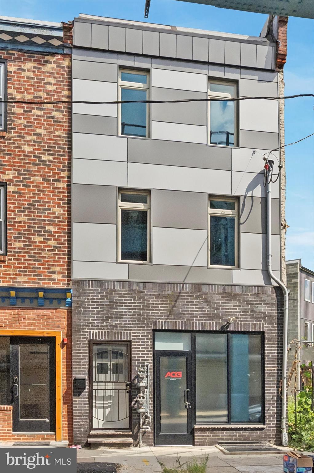 This versatile mixed-use property offers a rare combination of a 750 sq.ft fully functional commercial space and a beautifully updated 2 bedroom, bi-level residential unit above. A tax abatement is available for the period - 1/1/2025 to 12/31/2034. The first floor features a bright commercial area with laminated floors, recessed lighting, a kitchenette, powder room, and soaring ceilings that create an open and welcoming atmosphere. A rear alley and backyard provide convenient access and outdoor potential, while the basement offers generous storage space. Upstairs, the 2 bedroom apartment spans two levels of thoughtfully designed living. The entry floor boasts hardwood floors, a stylish kitchen with granite countertops, a farm-style sink, white shaker cabinets, and stainless steel appliances including a gas range, microwave, refrigerator, and dishwasher. A powder room and recessed lighting add comfort and convenience. The upper level features two bedrooms, a full hallway bath with tub, an in-unit washer and dryer, and a utility closet for extra storage. Located in a vibrant and transit-friendly neighborhood, this property is surrounded by shops, restaurants, and community amenities, making it an ideal choice for both owner-occupants and investors seeking strong rental or business potential. This incredible property has a fire alarm system and a security system. Schedule your showing today.