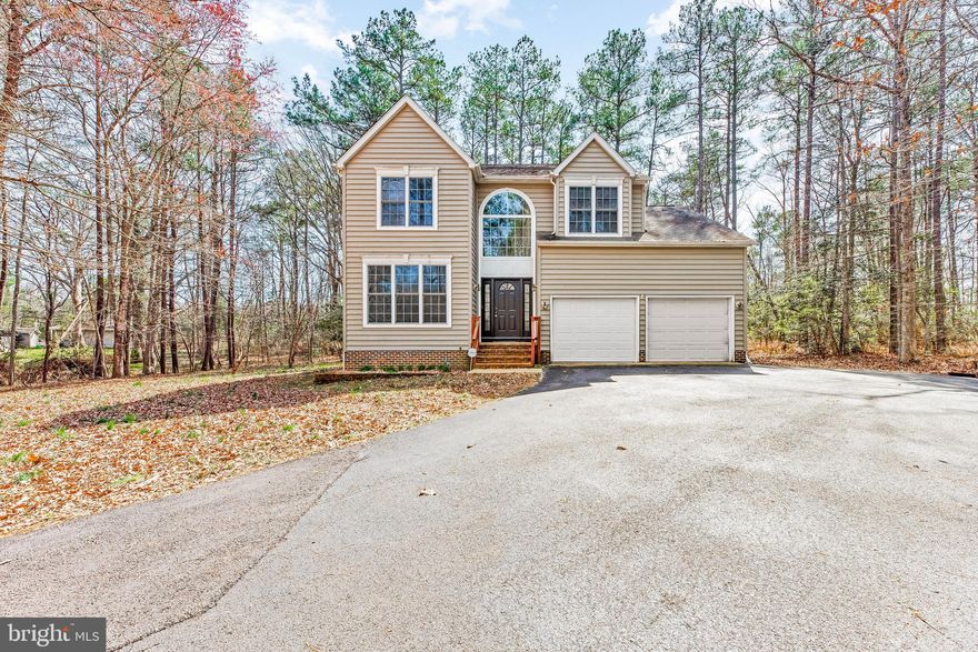 Looking for privacy? Look no further! With only being a half mile away from St Mary's River State Park, this 4 bedroom, 2.5 bath colonial sits on an acre that is hard to tell it was even there. Drive down the longer paved driveway and pull up to your front loading 2 car garage. When you park and walk in through the main front door, you'll notice right away the high ceilings and overlooking balcony, and greeted with a sitting room to the left that could make a great work area as well! Pass through to your formal dining room with hardwood floors, that leads you to your kitchen and living room! The living room has recessed lighting and high ceilings that has an additional overlooking balcony.  When you go upstairs you have a landing before entering into the primary bedroom. The Primary has just been freshly painted and has a huge walk-in closet, its own heating and cooling system (the home has three different control units!), a walk-in shower, dual sinks, and jacuzzi soaking tub! Additionally, upstairs you have the 3 generously sized bedrooms that have been freshly painted and another full bathroom. When you walk downstairs to the basement it is unfinished and waiting for it's new owners to design! There is a rough in for an additional bathroom, and a french drain system installed by Value Dry. Walk out to your back yard from the basement and enjoy sitting on your Trex Deck! Don't wait to schedule a tour see this Gem!