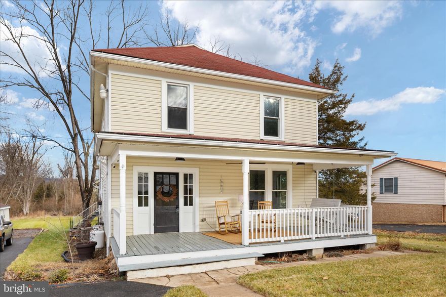 **BACK ON THE MARKET AT NO FAULT TO SELLERS!** Over 2,000 square feet of history and heart, quietly nestled within one of the area’s most treasured communities. Just five minutes from downtown Wardensville, where life unfolds at an easy pace—morning coffee runs, afternoons at the town park, weekends at the organic farmers market, and evenings wandering local bookstores and shops. This is a historic and highly desired location, where character is woven into the architecture and neighbors still wave as they pass by. And when the day calls for a little more hustle, Winchester, Virginia is only 30 minutes away. Here, you enjoy the best of both worlds—the charm and convenience of being in Wardensville, paired with the privacy of your own backyard retreat. This spacious and solid 3-bedroom, 2-bath home is a true slice of history, offering rooms that feel grounded, welcoming, and full of stories. Original wood floors run throughout, carrying the warmth and patina of generations past, while timeless molding—preserved from the home’s earliest days—frames each space with quiet elegance. A built-in curio cabinet stands as a beautiful reminder of the craftsmanship of its time, perfect for displaying treasured pieces or everyday keepsakes. Tucked away on the back porch is a hot tub, creating a peaceful space for evening relaxation or entertaining under the stars. With two screened-in porches, a large front porch, and generous outdoor areas, there’s no shortage of places to slow down and soak it all in.
Inside, surprises await—like a workshop basement accessed through a hidden door… can you find it? A large unfinished attic offers ample storage now, or the potential to become a quiet escape, studio, or artist’s dream space. Throughout the home, you’ll feel the strength of great bones and the warmth of a time gone by, seamlessly paired with the comfort of modern living. This home doesn’t just stand—it invites you in, wrapping you in history, craftsmanship, and possibility. A rare and precious time capsule, ready for its next chapter. Schedule your appointment today and experience it for yourself. 

During ownership the Sellers have done/added the following:
 -House rewired in 2021
-All major appliances less than 5 years old 
-Instant on-demand hot water heater less than 5 years old 
-New 300 sq. Ft. back deck
-7-person hot tub 
-Historic Hardwood floors refinished
-New 8 x 16 shed
-Kitchen, bathrooms newly remodeled 
-Original clawfoot tub and sink
-New lighting/fan fixtures 
-Custom built kitchen an dinning room table