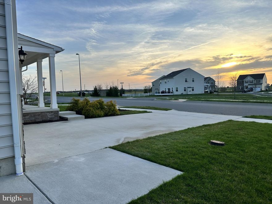 Spanning approximately 4,450 square feet, this impressive SENECA model 4 bedroom, 4.5-bath residence is less than four years old and showcases BRAND NEW carpeting throughout the entire upper and lower level — offering a move-in-ready experience that truly feels better than new construction, without the wait. Welcome to 712 Wallasey Drive — an exceptional residence , Builder's former MODEL HOME, thoughtfully designed and beautifully appointed throughout and is in the sought-after Preserve at Deep Creek community. From the moment you arrive, the striking upgraded elevation, manicured expansive landscaping, and inviting full-width front porch create a memorable first impression. Inside, a gracious foyer welcomes you, flanked by a private study—ideal for a home office and a conveniently located powder room. The main level unfolds into an elegant dining room before opening to an expansive, light-filled living space designed for both everyday living and entertaining.
The heart of the home is the stunning, modern kitchen, featuring crisp white cabinetry with crown molding, white quartz countertops, and designer lighting. A generous center island anchors the space, complemented by stainless steel appliances, gas cooking, a vented hood, and a spacious walk-in pantry. The adjoining eat-in area offers seamless access to a large, low-maintenance deck overlooking a level yard, perfect for gatherings and outdoor enjoyment. Throughout the first floor, upgraded luxury vinyl plank flooring enhances both style and durability.
The inviting family room is centered around a cozy gas fireplace, while a thoughtfully designed arrival center just off the garage adds everyday convenience and organization.
Upstairs, the expansive primary suite serves as a true retreat, complete with dual walk-in closets and a spa-inspired en-suite bath featuring a large tiled shower. Three additional bedrooms provide ample accommodations, including a full bath on the hall way and a private en-suite—ideal for guests. Each bedroom includes a walk-in closet, and all bathrooms feature attractive, easy-care tile flooring. A versatile loft space offers additional room for relaxation or entertainment, while the upper-level laundry room adds practical ease. The fully finished lower level extends the home’s living space with multiple areas for recreation, media, or fitness, along with a full bath finished to the same high standards as the upper levels. There is great size room that is partially finished, offers flexibility for conversion into a fifth bedroom. Additional highlights include abundant recessed lighting, large windows through out the house, that fill the home with natural light, a side-entry garage door, an irrigation system, a dual-control for the Carrier HVAC system, and a tankless water heater—all contributing to comfort, efficiency, and modern living. Don't forget the low fee HOA that offers lawn maintenance and landscaping along with access to amenities like club house, gym, pool, basket ball court and playground making this best place to call it home.  It is ideally situated  within a mile from major shopping and dining and just moments from Route 301  and is in the highly rated Appoquinimink School District. Listing agent is one of the owner and licensed in DE.