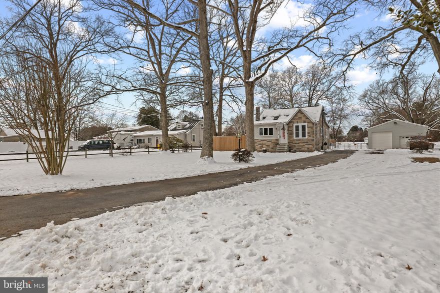 The perfect cozy renovated farmhouse with enormous detached garage and no HOA all on a level 3/4 acre lot SUPER convenient to Ft. Meade & BWI!!  You'll have plenty of room to enjoy the outdoors with extra deep front and back yards, fenced in area for play and direct access to the mechanics dream garage.  This generational home has been expertly renovated with modern conveniences like smart switches, recessed lighting, and energy saving double hung windows, public water & sewer!  Big modern kitchen offers wonderful natural light, beautiful and expansive granite counters, updated cabinetry with lots of storage and newer appliances.  The front foyer with coat closet can double as a picturesque work/study space.  Large living room with plenty of space for a dining table or play area.  Wonderful starter or downsize home for the one looking for more outdoors and endless possibilities in the oversized garage.   Schedule a tour today!