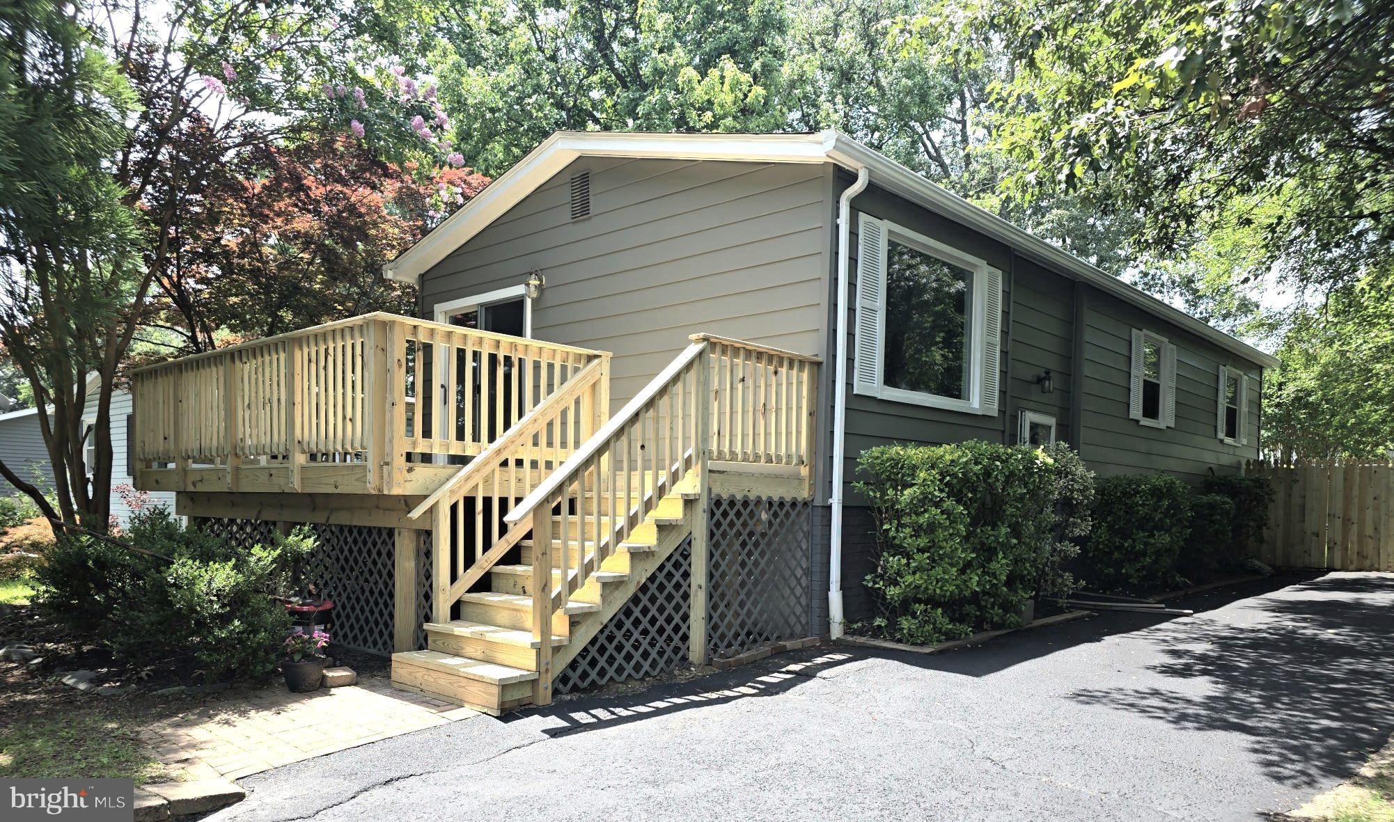 Welcome to the perfect desirable water privileged community of Woodland Beach “Move In Ready” adorable home - split level single family home offers finished 1780’ sq footage – 3 bedroom 2 bath with 2 levels of living space within walking distance to private community amenities and waterfront. It's all here, the complete package, a lovely home in an awesome community – NO HOA with access to private community beaches, fishing pier and community docks, playgrounds as well as several local marinas & London Town community center to enjoy waterfront lifestyle community.
Recently renovated, upper-Level features kitchen, dining room and living room open floor plan with sliding glass doors to beautiful large deck - perfect to relax & enjoy fresh air, morning coffee or just unwind with family & friends. Refinished hardwood floors on all upper level with spacious Primary bedroom & walk-in closet, 2nd bedroom & bathroom. Lots of updates with new stove & dishwasher, neutral cabinets and gorgeous white countertops. Lower level consists of 3rd Bedroom with lots of natural light, 2nd bathroom & Large family room with new LVP flooring & Tile with walkup steps to private fenced back yard. Enjoy the fresh air from your private backyard which includes spacious shed for projects or storage space, Cozy Wood burning fireplace in lower family room with well ventilated efficient newer exhaust. Home is sold “AS IS” – all major items have been updated or taken care of – see list of improvements of the property.
Located in the heart of Woodland Beach, this community offers 5 beaches, community docks, a marina, multiple boat ramps, playgrounds, and green spaces. Come live the Woodland Beach lifestyle and be on vacation all year round! Canoe, Kayaks & storage, Boats, Navigable water, Private & Public beach access, swimming allowed, fishing allowed, water access off of Glebe Creek to South River. Easy access to Rt50 and 97 makes fast commuting to Baltimore and Washington.
Professional Photos Coming!