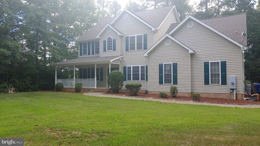 GREAT NEWS...interest rates are climbing but the current owner has this VA loan with Freedom Mortgage and is assumable with a 2.25% interest rate if you qualify. Looking for privacy? You’ll find it with this 5 bedroom/3 full bath Colonial home located just south of the Patuxent River Naval Base. The home is nestled on 2 acres, with a barrier of trees surrounding it. As you approach the home, imagine yourself sitting on your covered front porch sipping your favorite beverage. When you enter the home, you will be greeted with the two-level foyer that is open to the upper level. The main level is great for entertaining with friends and family with the open flow of the Dining Room, Kitchen (with stainless steel appliances and breakfast bar), Breakfast Nook, Family Room and Sunroom that flows to the back deck for more entertaining.  Also, on the main level is a bedroom with a full bath. Upstairs, you will find the other 4 bedrooms with one being the primary suite with a bathroom that has a soaking tub, dual sinks, separate shower and a walk-in closet. The home was freshly painted for you to move right in. The crawl was just professionally conditioned. The community offers an in-ground pool that has half size Olympic lap lanes and a Clubhouse. Don’t let this one pass you by, call today for your private showing!