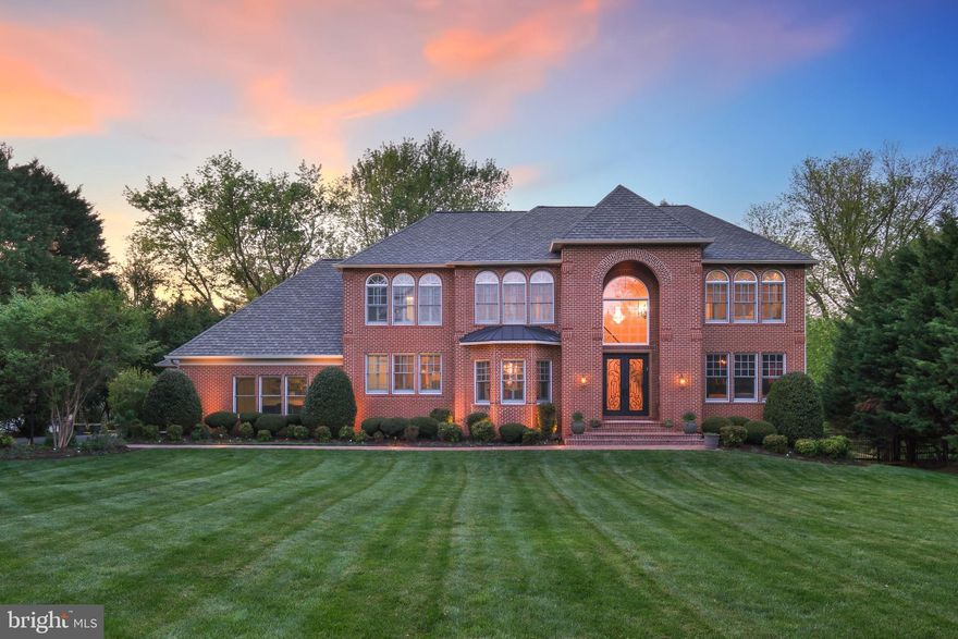 Welcome to 11724 Gainsborough Road – where timeless elegance meets contemporary luxury. Boasting over 9,700 square feet of meticulously designed living space, this extraordinary residence seamlessly blends classic architectural details with modern sophistication. From grand entertaining spaces to serene private retreats, every inch of this home reflects exceptional craftsmanship. Thoughtfully reimagined during a full-scale addition and renovation in 2012, this home offers refined craftsmanship and upscale finishes at every turn. From the moment you step through the custom-imported iron front door, you’re greeted by a grand two-story foyer that sets the stage for what’s to come. Inside, soaring 12-foot ceilings and oversized Marvin windows flood the space with natural light, creating sun-drenched interiors. Gracefully arched entryways and rounded bullnose corners add a touch of architectural elegance, elevating the timeless design. Throughout the home, a mix of gas and wood-burning fireplaces, coffered ceilings, and custom-built-ins bring warmth, depth, and character to every room. At the heart of the home is a spectacular kitchen, perfect for entertaining. Dual sinks, three ovens, two warming drawers, two microwaves, two dishwashers, and a butler’s station with an additional sink make meal preparation a breeze. Hand-built cabinetry, luxury granite countertops, natural Italian stone floors, a walk-in pantry, two Sub-Zero refrigerators, and a wine fridge ensure this culinary space is as functional as it is beautiful. The grand living room and inviting family room flow seamlessly into the kitchen, creating an open and connected layout ideal for both relaxed living and entertaining. The family room features a hand-crafted stone fireplace, adding both warmth and character, while the formal dining room sets the stage for memorable gatherings. Two thoughtfully placed powder rooms offer added convenience for guests. The cozy library, with its rich custom mahogany woodwork, built-ins, and chandelier-lit sitting area behind French doors, invites you to unwind. For work or study, the dedicated office offers a quiet retreat, complete with built-in storage and workspace. Two oversized garages—one for two cars and one for a single vehicle—offer abundant space for storage or hobbies. Both garages offer direct access to a spacious mudroom outfitted with custom cabinetry. Upstairs, six generously sized bedrooms provide ample space for family and guests. The luxurious Primary Suite boasts vaulted ceilings, a built-in refrigerator, and a spa-style bathroom with high-end finishes. The finished lower level is a perfect space for recreation and relaxation, featuring a built-in play area, multiple storage rooms, a gym, a full bathroom with a steam shower, and a private guest suite ideal for in-laws or an au pair. Step outside into the expansive backyard, designed for effortless entertaining and relaxation. The oversized 1,400-square-foot deck, crafted from durable Ipe wood, provides ample space for gatherings or quiet moments. The impressive outdoor kitchen features a built-in grill with a natural gas connection, a sink for added convenience, and ample counter space for al fresco dining. Other highlights include a dedicated dog shower for pampered pets and raised garden beds, perfect for growing herbs, vegetables, or flowers. The roof, replaced in 2016 is a  GAF Designer Series, Camelot Ultra-Premium Collection, Antique Slate, offers long-lasting performance with a Lifetime warranty. Inside, the home features a fully integrated Control4 smart system, giving you easy control over lighting, surround sound, security cameras, and TVs. A Kohler natural gas generator ensures reliable backup during power outages, while a smart heating and air system maintains comfort and efficiency throughout the year. 11724 Gainsborough Road is a true masterpiece.