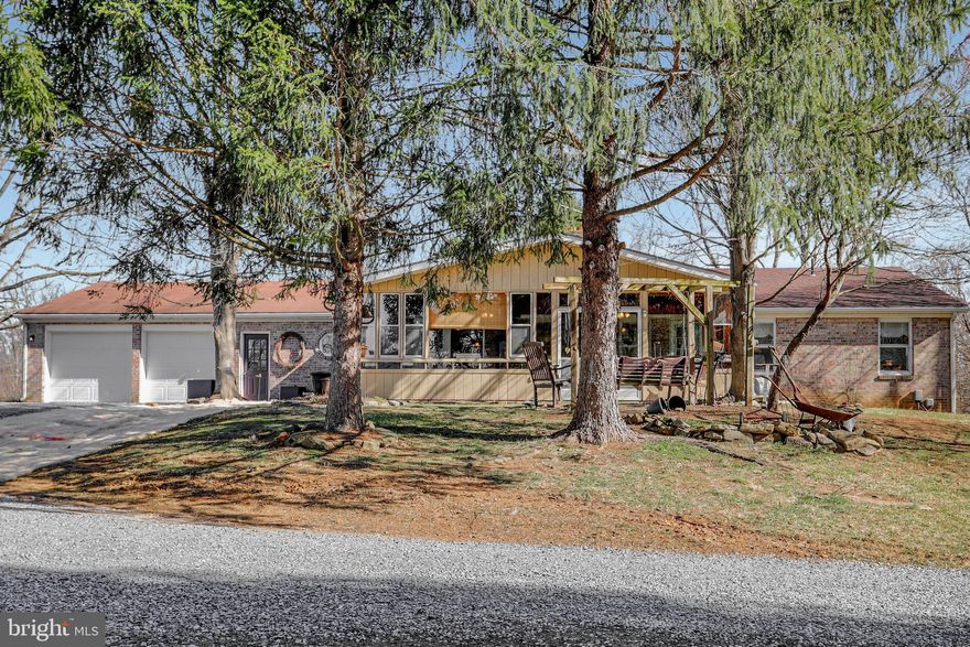 If you're looking for convenient one-floor living in the country, you will love this 4 bed, 3 bath rancher just outside of Shepherdstown! The finished basement (complete with bedroom, bathroom, kitchen, and separate entrance) would work great as an in-law suite or rental. This home features walkout level entrances to both the main level and the basement. There is an attached two-car garage in the back of the home, and the walkout basement entrance is accessible directly off the driveway as well. On the main level, there is a beautiful sun room, three bedrooms, and two bathrooms. This home sits on a 2.14 acre lot with a nice mix of trees and grass and has a swimming pool and large outbuilding. Carpet was just replaced. No HOA! Light restrictions will be negotiated as part of sale.