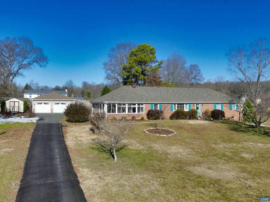 Beautifully updated and maintained brick ranch in Key West. Just 2 miles to Pantops yet you feel out in the country. The custom kitchen was added in 2018 and features granite counters, cherry cabinets, and breakfast bar which transitions to the two-wall windowed dining area bringing the mountain views inside. The original kitchen area still operates as a 2nd kitchen with the addition of a laundry and patio entry sitting area. The expansive family room holds the fireplace which has wiring for electric logs or can be converted to propane logs (not used by the owners). Walkout French doors lead to the covered and open patio areas. A separate living/sitting room and home office complete the left side of the home. The right side holds the primary suite, 2 front bedrooms and a second full bath. Cherry doors grace the main level. Continue down to the rec room, 4th bedroom with full bath and large unfinished basement area. The 2018/19 garage is about 1000 s.f. with 2 bays and a bonus workshop area behind. Extra power has been run to install an HVAC in the garage/shop if desired. New architectural shingle roof in 2025. Click on the virtual tour link to take a 360-degree walkthru tour. Ting available soon.,Cherry Cabinets,Glass Front Cabinets,Granite Counter,Wood Cabinets,Fireplace in Family Room