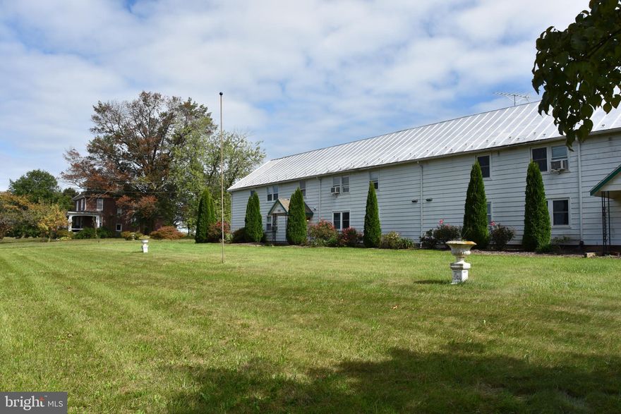 8 UNIT RENTAL PROPERTY WITH AN ADJOINING 4 BEDROOM HOME, SETTING ON OVER 7 ACRES WITH A MOUNTAIN VIEW TO THE WESTERN SUNSET. LIVE IN THE 4 BEDROOM HOME THAT IS AWAITING YOUR PERSONAL TOUCHES AND UPGRADES as you oversee your Rental Business. All of the 8 Units are 2 Bedroom and full bath with a LARGE Living room and eat in Kitchen. Units are in very good care and are very easy to rent with this great country feel of living. Property also has a 2 CAR DETACHED GARAGE with space to maybe open a little business as the property is zone CR which is Commerical/Residential. 5 other Large outbuilding are on the property awaiting maybe a Storage Rental or other Business opportunity. Bring your ideas as this property has unlimited potential as a Home Site, an established existing Rental Building ,additional buildings to use for your ideas and the possibility that the 7 Acres could be divided if you desireand the county allows.   also see Listing MDCR2016686