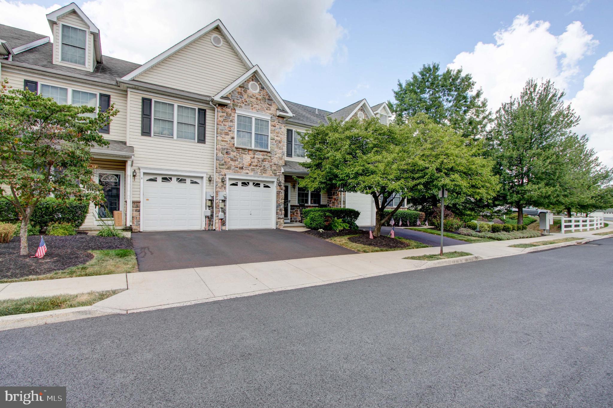 - Welcome to 5 Ryan Court, a meticulously maintained home in the serene Ryan Court townhome community in sought after Souderton SD. This gorgeous home offers timeless elegance, traditional charm, and upscale amenities throughout. Beautifully and tastefully decorated and thoughtfully designed, this move-in ready townhome blends style, function, and comfort in every space.This quaint cul de sac community boasts well manicured landscaping and mature trees throughout.
- Enjoy relaxing on the front porch in the shade of a gorgeous, mature flowering tree before stepping inside to find an open concept main floorplan featuring a seamless living and dining room combination, accented by crown molding, recessed lighting, and hardwood floors on the main level. The kitchen is well appointed with classic granite countertops, pantry and stainless steel appliances include a double oven that makes preparing meals for either a few or a crowd a breeze. The bright, light-filled 2 story family room is the heart of the home and perfect for gathering family and friends with easy access to the kitchen as well as the rear deck and patio.
- Moving upstairs and along the hardwood hallway, you will find a gorgeous main bedroom featuring 2 large closets complete with closet systems and a private en-suite bath that includes a walk-in shower and double vanity enhancing the home’s comfort and appeal. The upper level also features 2 spacious secondary bedrooms, a hall bathroom and convenient laundry. There is also an abundance of storage space in the attic, accessible by pull down stairs.
- Last but certainly not least, the fully finished basement extends your living space and is designed for entertaining with a built in wet bar and ample space to enjoy the game or a movie, host family and friends and more! You will find endless ways to use this versatile space! Whether you need a home office, a gym or a playroom, there is plenty of space! There is also tons of storage room in several closets.
- Highlights include a newer HVAC and water heater (2023), newer sump pump (2020) and thoughtful upgrades including outlets with built-in USB ports, adding convenience for today’s lifestyle and peace of mind; New deck for outdoor enjoyment; Large attic for storage; Garage parking plus driveway space and Overflow parking for guests.
- With a combination of traditional elegance, modern enhancements and virtually maintenance free living, 5 Ryan Court is move-in ready and designed for both everyday living and entertaining. All of this and just minutes to routes 309, farmer's markets, shopping and entertainment - it's truly the best of both worlds!