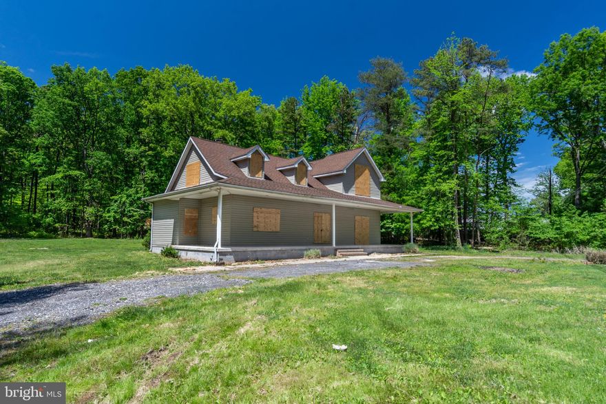 UNIQUE OPPORTUNITY TO RENOVATE THIS 2600 SQ FT. HOME ON AN 1+ ACRE LOT!  Property is in need of a full renovation.  Main level features a dining room, kitchen, family room, half bath, and Master suite with a full bath and dual walk-in closets.  Upper level has 3 bedrooms and a dual entry bath.  The full unfinished basement has tall ceilings and can be finished to add more living space.  Property is located in a secluded location and surrounded by trees but still convenient to shopping, restaurants, and major roadways.  Buyer to verify property lines.  Sold As-Is!