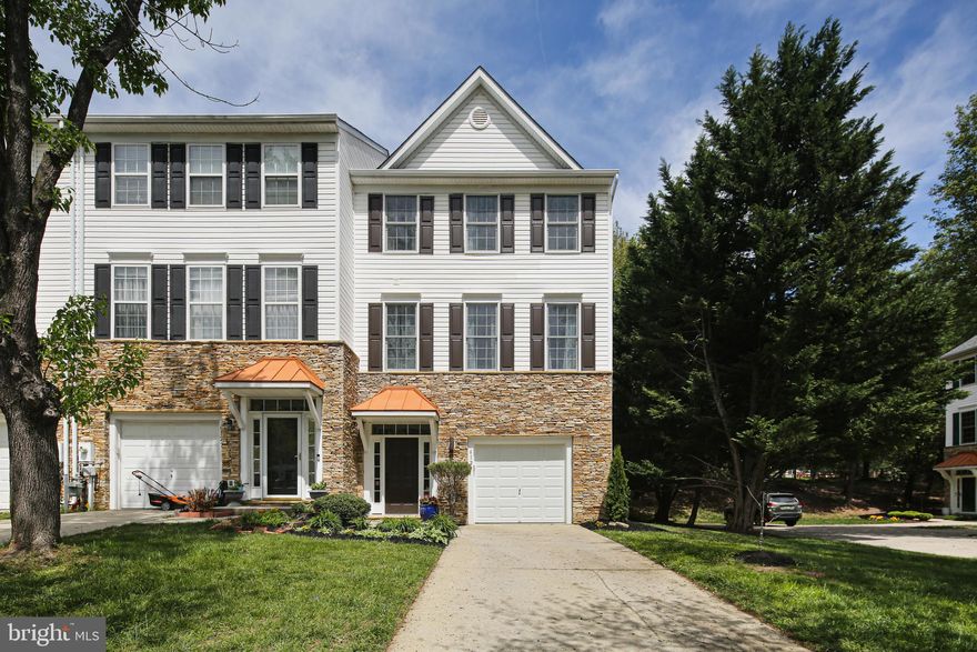 Welcome to this stunning end unit of the largest Columbia Builder’s model, rarely available in River Hill community! Spacious, bright with 9’+ ceilings all 3 levels, 4 bedrooms, 2 full and 2 half bathrooms, and finished walkout 1st level.
Spectacular main level boasts a large luxurious kitchen and dining area, open and highly functional. Updated SS appliances. Custom cabinets with glass doors and pantry for organized storage were added (2024). Recessed and modern LED lights installed (2025). A French door from the living room leads to a low maintenance composite deck. Family room features a centered gas fireplace with waterfall windows on both sides. Multiple windows on all 3 sides let in more natural light. Hardwood floors entire main level and all stairways. An extended powder room is conveniently located at the main floor. Upstairs, 3 generously sized bedrooms offer vaulted ceilings, double windows, and big closets. The primary bedroom features 2 walk-in closets, vaulted ceilings with a fan, and en-suite bathroom with soaking tub and separate shower. The 1st level is also very comfortable, beautifully designed and updated with an inviting entrance, a half bath, a large room with French doors, full windows, modern ceiling fan with LED lights (2025), office area, a big walk-in closet with stylish barn door (2024) and another French door to the new patio and outdoor lighting (2024) great for entertaining.  New carpets installed within 2 years. Professional landscaping around the house (2024 and 2025). In addition to an oversized one car garage, long private driveway, this awesome end unit enjoys extra parking at the side parking pad, and common parking lots at front. Super convenient location: walk to shopping centers, Giant grocery store, restaurants, professional services, urgent medical care, banks, barber shop, gym, CA indoor and outdoor swimming pools, kids tot lots, playgrounds, and miles of trails around the wonderful River Hill Village. Minutes to River Hill schools, and easy access to 108/32/29/95, Baltimore, DC, Rockville, and Annapolis.