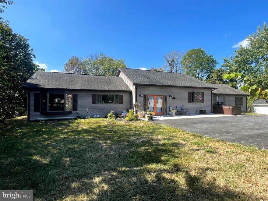 Back on the Market, better than ever!  Price improved reduced by 10k.  Sellers have added home warranty to listing and have had radon mitigation completed.  Sellers have found home of choice and are open to reasonable offers.   Come view this beautifully updated 3-bedroom, 2-bathroom home just minutes from the heart of Berkeley Springs! No HOA. Nestled on a spacious lot, this property offers the perfect blend of modern comfort and cozy charm.  Step inside to an inviting open-concept layout featuring one level living, a large kitchen, island, pantry and generous living area — perfect for entertaining or relaxing with family.    Enjoy your morning coffee or host unforgettable fall BBQs on the expansive back deck, overlooking peaceful natural surroundings. The unfinished basement provides plenty of additional storage space or potential for future finishing.  A detached 1-car garage includes a bonus workshop space with electric, ideal for hobbyists or extra storage. Plus, the home and garage sit on separate parcels, offering added flexibility for future use.  Located close to VA, PA, MD, and major commuter routes, this home is perfect for those seeking both convenience and tranquility.  Don’t miss your chance to own this move-in-ready gem — schedule your private tour today!
