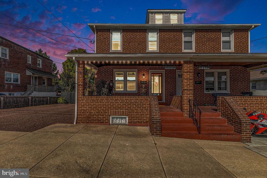 Welcome to 333 Hurst Street, where you'll find not only a charming home but also a versatile bonus building in the rear—perfect for a she-shed, he-shed, or your next creative space! Picture yourself spending summer evenings relaxing on the spacious front porch, soaking in the fresh air.  Step inside to gleaming hardwood floors and an open floor plan that creates an inviting, spacious atmosphere. The family room is a cozy haven, featuring a fireplace with an updated tile surround, a newer mantel, and stylish farmhouse lighting. Custom built-in shelving and cabinets flank the fireplace, making it the room's natural focal point. The dining area, adjacent to the family room, carries on the farmhouse aesthetic with matching lighting. Beyond the dining room is a flexible space that can be used as a cozy sitting area, home office, or even an expansion of the kitchen—perfect for anyone ready to take on a home improvement project! The light-filled kitchen, located at the rear of the home, boasts white cabinetry, tile flooring, and a striking black single French door that opens to the incredible backyard.  The backyard is an entertainer's paradise! Fully fenced with a lovely patio, serene fishpond, and the standout feature—a converted garage with vaulted ceilings and sliding glass doors. This versatile space can serve as a poker room, sports den, craft studio, or book club gathering. Complete with kitchen cabinets, a sink, refrigerator, and a full bathroom, the possibilities are endless! The finished lower level adds even more living space, featuring a fireplace, full bathroom, and a small kitchenette with tile floors. Another single French door leads to the backyard, bringing in ample natural light.  Upstairs, you'll find three well-appointed bedrooms with hardwood floors and a full bathroom. Many windows throughout the home have been replaced, enhancing energy efficiency and comfort. Don’t miss this incredible opportunity—schedule your showing today!