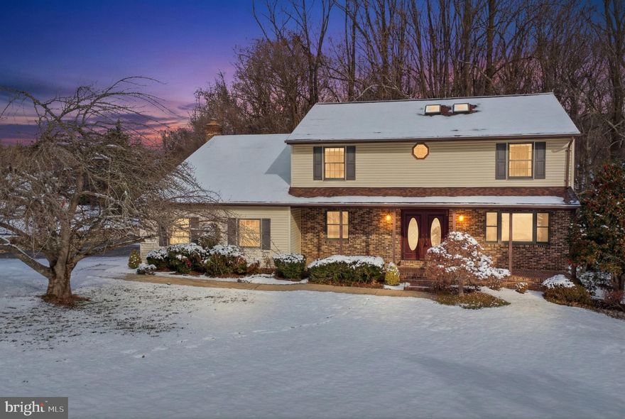 Set on over an acre of private land, this 4-bedroom, 2.5-bath colonial offers classic charm. The main level features a bright office, a wood-burning fireplace, a kitchen with stainless steel appliances, a dining room, 2 living room spaces, and a convenient laundry room. Upstairs, the primary suite includes a walk-in closet and en-suite bath, with three additional bedrooms for flexibility. The basement is HUGE and unfinished for endless possibilities. Outside, the large deck is ideal for relaxing or entertaining. With a new septic system and generator, this home is move-in ready for year-round comfort.