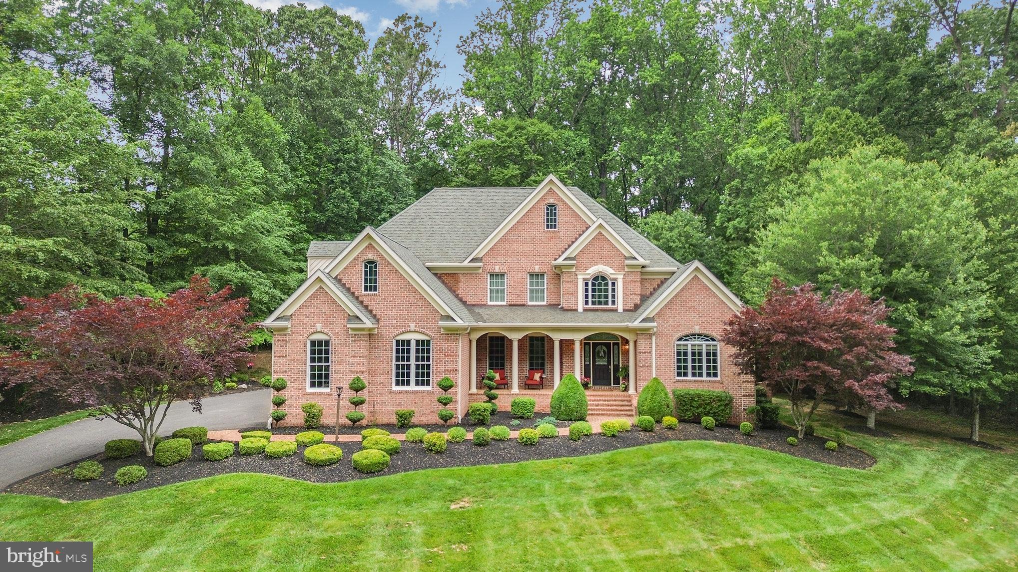 Welcome to this stunning 5-bedroom, 3.5-bath home offering an exceptional layout and thoughtful upgrades throughout. The grand two-story foyer welcomes you with gorgeous hardwood floors, elegant crown and chair moldings, and a dedicated home office just off the entry. The main level features a spacious living room with a tray ceiling, custom electric fireplace, and rich hardwood floors. Large French doors along the back wall open to a beautiful brick patio, creating a seamless indoor-outdoor flow. Just off the living room, the formal dining area showcases a tray ceiling, custom moldings, and hardwood floors, with a convenient bar-style opening to the kitchen. The kitchen is beautifully updated with white cabinetry, quartz countertops, a large island, built-in oven and microwave, pendant lighting, hardwood floors, and a walk-in pantry. Its open-concept design allows for easy interaction between kitchen, dining, and living spaces. Off the kitchen, a bright and airy sunroom features vaulted ceilings, hardwood floors, and walls of windows—currently used as a casual dining space. Also on the main level, the primary suite is tucked privately at the back of the home and includes hardwood flooring, a tray ceiling, crown moldings, a ceiling fan, and three walk-in closets. The en-suite bath offers a double vanity, soaking tub, oversized glass-enclosed shower, and a private water closet. A powder room for guests and a large laundry room with tile flooring, located just off the garage, complete the main floor. Upstairs, you’ll find four generously sized bedrooms. One serves as a second primary-style suite with access to a buddy bath, large vanity, and tub/shower combo. The additional bedrooms feature ceiling fans, great closet space—including two with walk-in closets—and plenty of natural light. A shared hall bath with a jack-and-jill layout includes a double vanity and a private toilet/shower area. A second full bath is also located on this level, offering added flexibility for a growing household. The lower level offers a massive finished space perfect for recreation, a home gym, or a media room. A full bath area has already been framed out and is just waiting for your final touches. Outside, the home boasts a large brick patio with access from both the living room and sunroom, ideal for entertaining or relaxing outdoors. The property is serviced by well water, a septic system, and a heating setup that includes both electric and leased propane (via Dixie). Cooling is provided by electric A/C, and the water heater is propane. Attic storage adds extra convenience, and all furniture is negotiable. Don’t miss this meticulously maintained home with room to grow, entertain, and enjoy both indoor luxury and outdoor living!