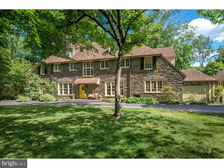 Called "Maple Oaks" for the exquisite mature trees that beautify its sprawling grounds, this grandest of Main Line Manor Homes is truly a sight to behold. Masterfully built by EJ Hedden Company over 90 years ago stands a stunning English-style estate that's been extensively updated by current owners & meticulously cared for as it deserves to be. Nestled amid manicured parklike environs is a majestic main house & separate pool cottage/garage providing an oasis for residents & guests. An electric gate & fence plus lovely foliage envelope the property. Generous grass lawn, a private backyard, elevated pool patio, updated outdoor kitchen, in-ground pool, fire pit & separate awning-covered flagstone terrace off the family room inspire entertaining to your heart's content. From this world all your own in a sought-after family neighborhood, you're just minutes away from many conveniences, with walkability to the Wynnewood train, Suburban Square, Whole Foods & award-winning schools. This home's rich pedigree is seen in every detail, from extensive traditional Pennsylvania stonework to the period doorknobs. Airy ceilings, wood-burning fireplaces, hardwood floors, oversized windows & fine finishes enhance sophistication. The flow & floorplan are perfect for living & hosting, with a seamless connection between the main rooms & outdoor areas & pool. An entry vestibule accessing a sunken powder room opens to a grand reception hall with French doors to a sitting room/office presenting a striking underfoot view of the wine cellar. French doors from the living room with fireplace open to the flagstone terrace & the wonderful sunroom/media room, with triple exposures & Palladian windows facing front & rear. The dining room with a fireplace also accesses the terrace. The sunny newly-updated chef's kitchen with new Carrera marble counters & center island, professional appliances including double ovens & a separate eating area is a favorite gathering spot. On the hardwood 2nd floor sit 3 bedrooms, a study/nursery with balcony, new laundry & updated baths. The master retreat is complete with a sitting room with fireplace, his/her walk-in closets & en-suite bath with a Whirlpool tub & custom frameless glass-enclosed shower. Three bedrooms & a bath are perched on the 3rd floor. A huge finished basement offers an updated powder room, 2nd laundry & abundant storage. Off the mudroom awaits the pristine fully-outfitted pool cottage/1-car garage affording the ultimate comfort.