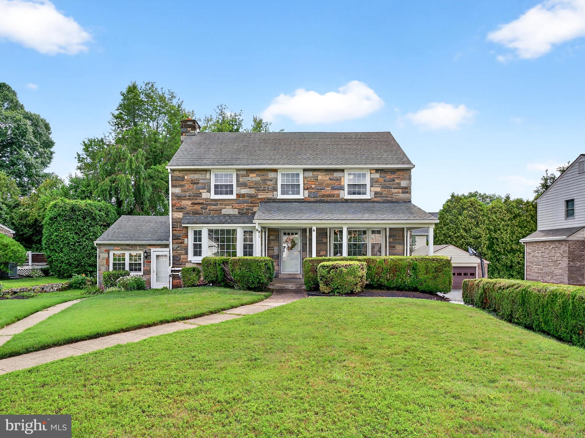 Welcome to this stunning stone colonial located in the desirable North Aronimink section of Havertown! Offering over 3,000 square feet of living space, this spacious home truly has it all—generous rooms, multiple bedrooms and bathrooms, a newer roof and windows, beautifully updated kitchen and baths, gleaming hardwood floors, and a private driveway with ample off-street parking. Enjoy the comfort of central air and efficient gas heat, plus an incredible bonus: a separate, private office with its own entrance—perfect for a home-based business!
Step inside from the charming front porch into a spacious center hall foyer. To the left, you'll find a cozy living room with a fireplace, and to the right, a formal dining room—both featuring bright bay windows that flood the space with natural light. The updated kitchen boasts stainless steel appliances, new countertops, tile flooring, and abundant cabinet space. A newer powder room, convenient first-floor laundry, and a family room with built-ins and another bay window complete the main level.
Upstairs, the second floor features a large primary suite with a renovated bathroom, three additional spacious bedrooms, and another updated full hall bath. The finished basement adds even more versatility, offering a full bathroom, a second kitchen, laundry area, and a large flex space—ideal for a family room, gym, or additional bedroom. With its own private entrance, this level is perfect for an in-law suite.
The attached office space, currently used by the owner, can continue to be used by professionals such as dentists, lawyers, insurance brokers, or accountants. Additional highlights include a lawn sprinkler system, walk-up attic for storage, and an attached garage.
This rare opportunity offers a beautiful home, flexible office space, and an unbeatable location—close to top-rated schools, shopping, public transportation, Route 476, and just 20 minutes to Center City Philadelphia!
