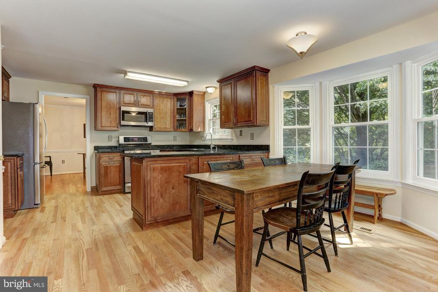 Private, one-of-a-kind lot overlooking pristine parkland! A tastefully renovated kitchen opens to a sun-drenched family room to create a perfect entertaining space. Downstairs, an expansive rec room opens to a shaded brick patio. Hardwoods on the main level, a full basement bath, stainless steel appliances and a 2 car attached garage round out the feature list!